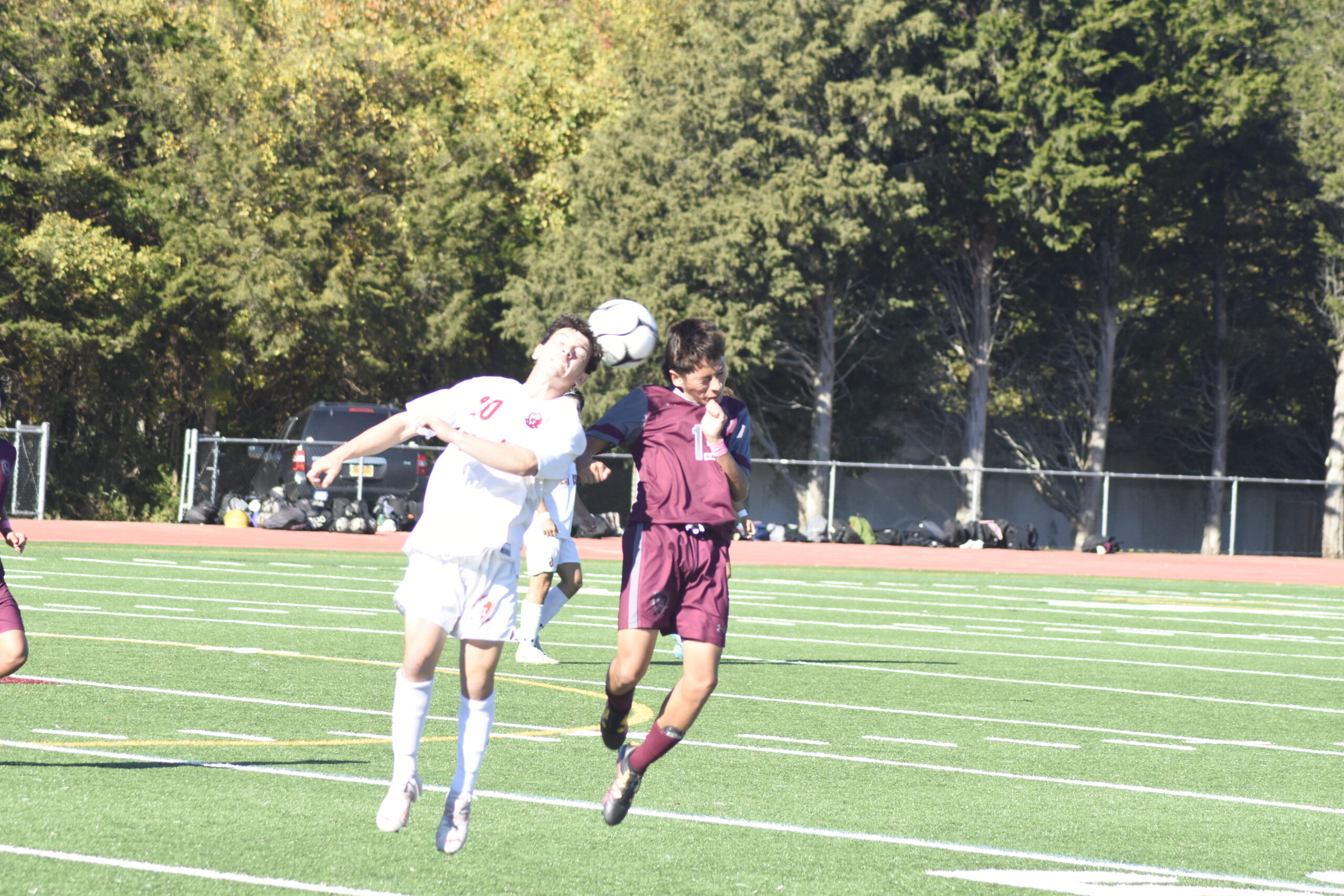 East Hampton junior Jeremy Ortiz goes up for a header with an East Islip player.    DREW BUDD