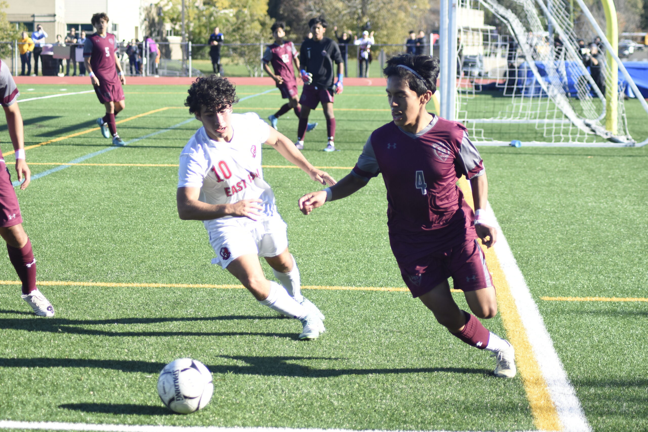 East Hampton sophomore Jonathan Armijos and an East Islip player play the ball deep in Bonac territory.    DREW BUDD