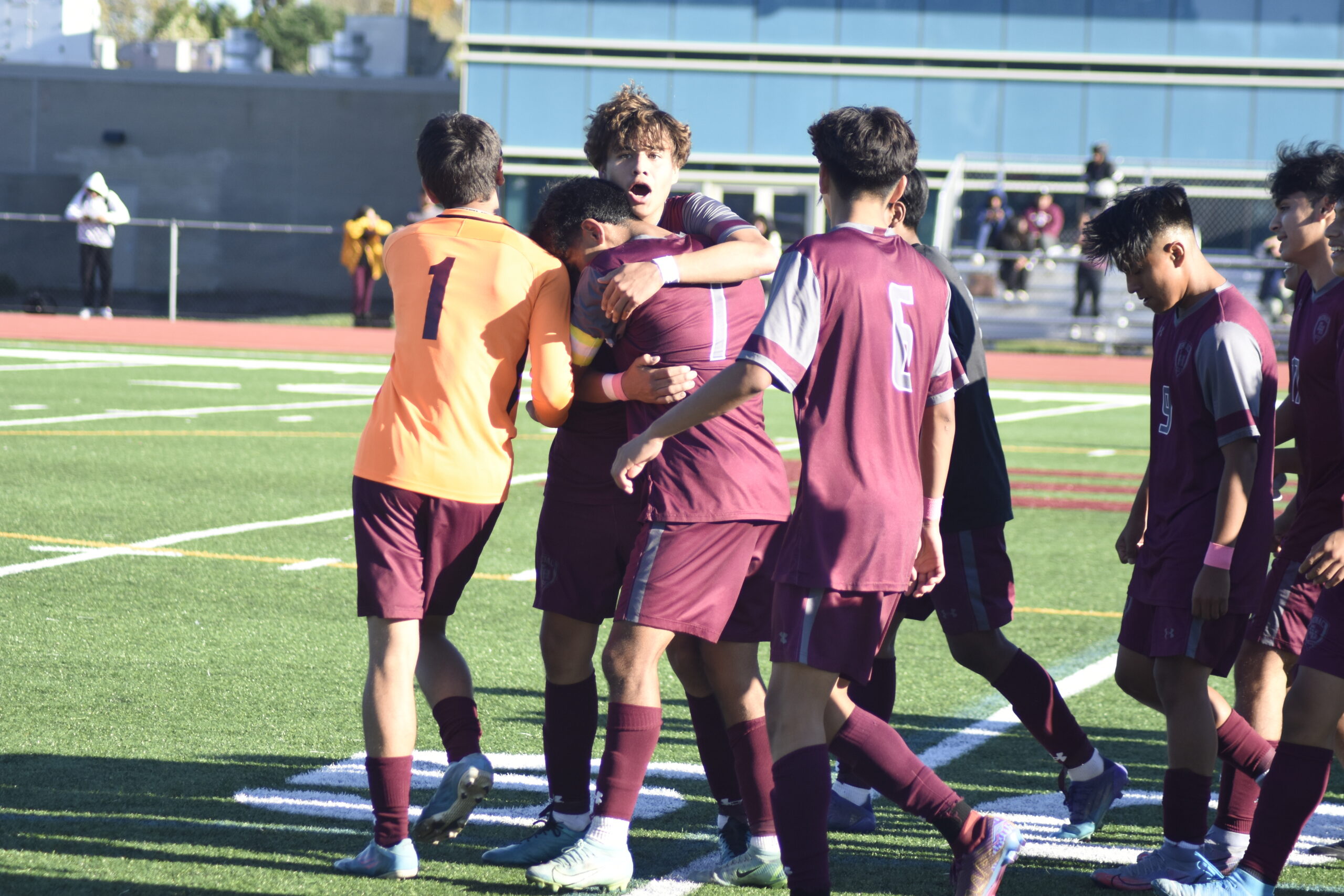 Bonacker Kevin Hilario and Michael Figueroa share a moment after the Bonacker's big victory on Thursday.    DREW BUDD