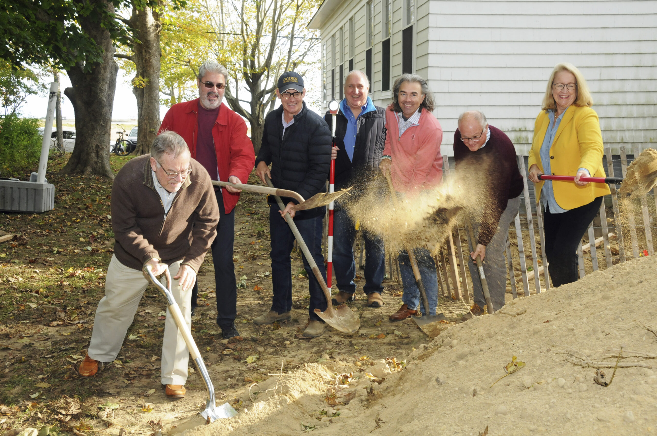 The Wainscott Sewing Society Team, John Nealon, Tom Osborne, Jake Ogden, Mike Hemmer, Bruce A.T. Siska, Drew Bennett and Hilary Osborn Malecki break ground at the Wainscott Chapel on October 28. The Society announced the Chapel was going to get indoor plumbing and a modern bathroom, replacing the outhouse. Society President Hilary Osborn Malecki grabbed a shovel along with the rest of the Team members responsible for the major upgrade, and broke ground for the project. Hilary officially thanked members of the East Hampton Town Government, accountant John Nealon, attorney Tom Osborne, contractor Jake Ogden, surveyor Mike Hemmer, architect Bruce A. T. Siska, engineer Drew Bennett and others for their special contributions.  RICHARD LEWIN