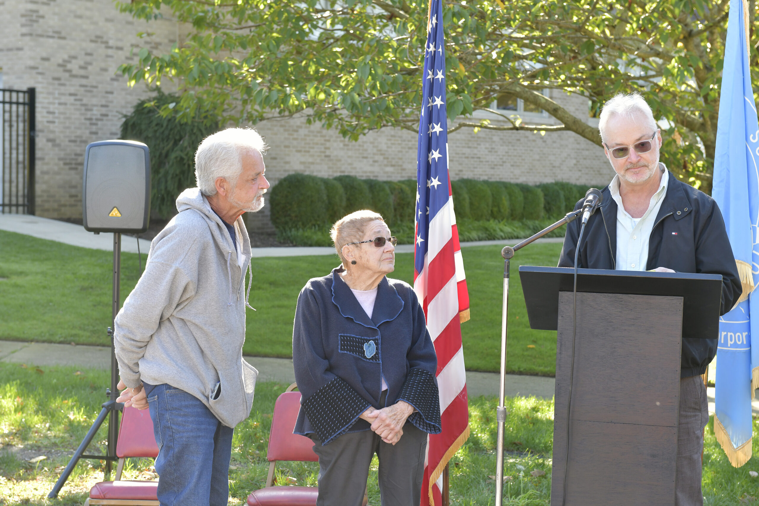 George Holden, Mary (Holden) Maran and Lester Holden, the children of John Holden, at the unveiling and dedication of the honorarily renaming of  Railroad Plaza to John I. Holden Plaza in Southampton Village on Saturday morning. Mr. Holden died last year at the age of 100. He was a World War II veteran, who volunteered his time to numerous community organizations such as the Rotary Club, the Boy Scouts, and the Southampton Fresh Air Home. His love for veterans led him to placing American Flags at the graves of those who served our country every Memorial Day and Veterans Day. John estimated he placed thousands of flags during the many years he carried out this tradition.
DANA SHAW