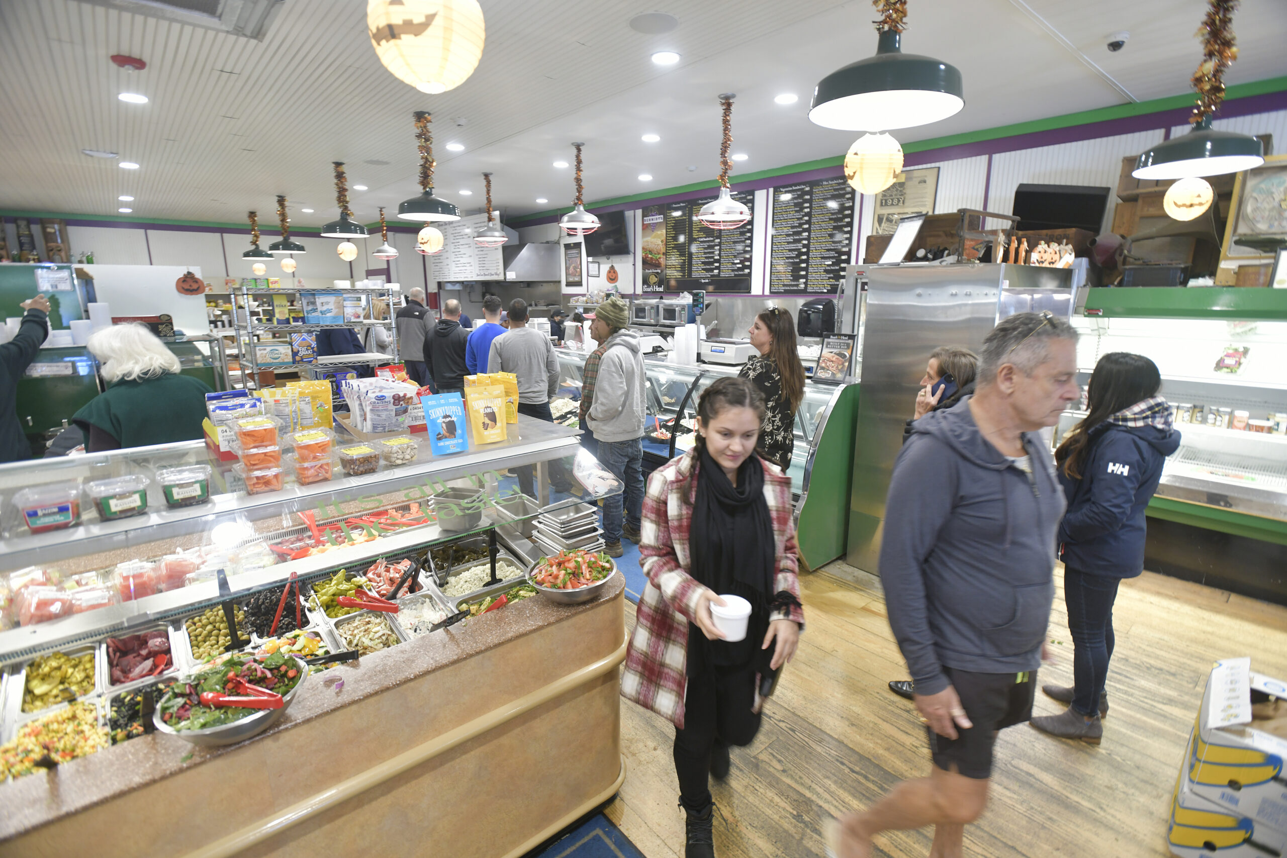 A steady stream of customers visited Schmidt's Market on Friday to say their goodbyes and pay their respects.   DANA SHAW