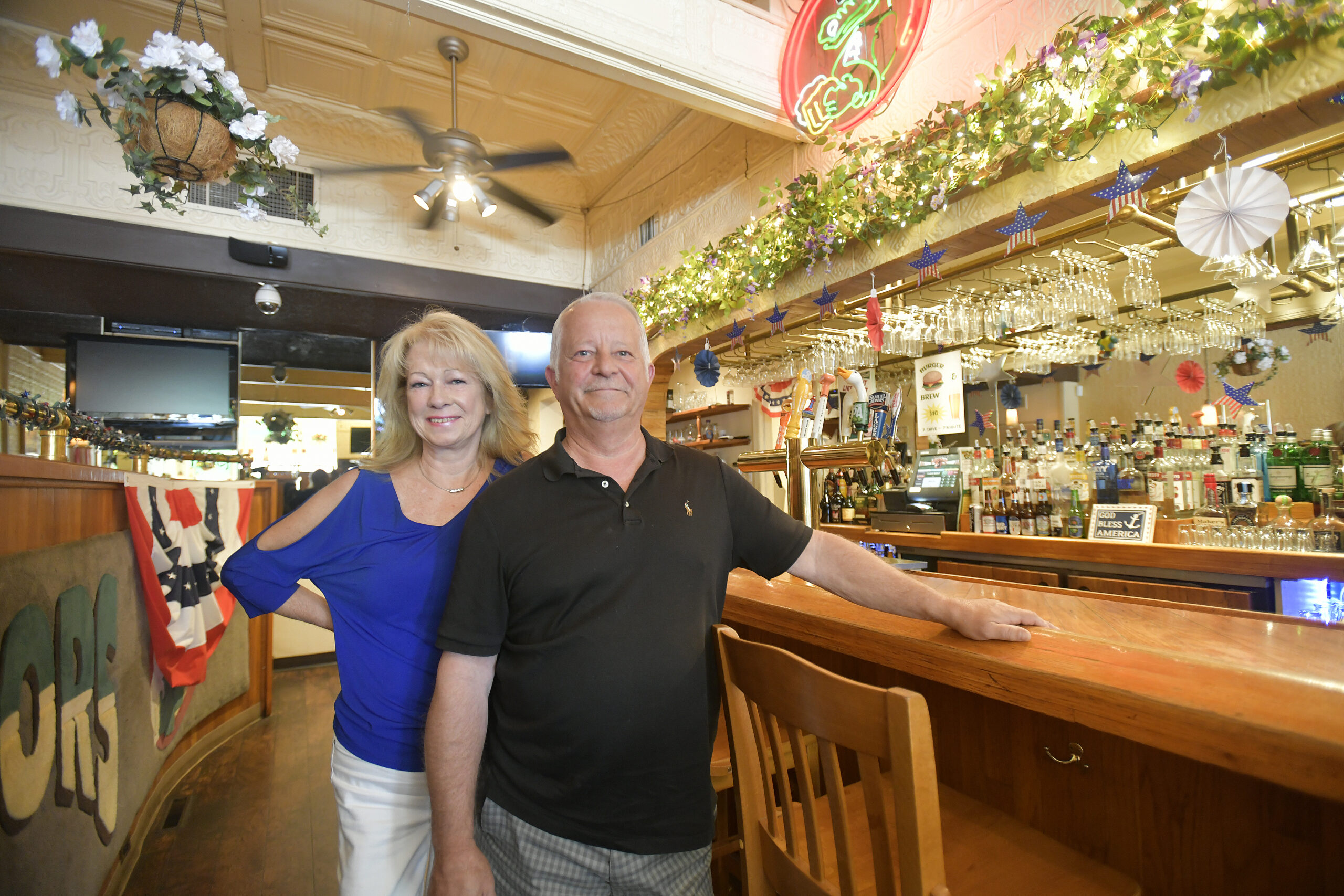 Diane and Richard Gise at the bar in Gators in Hampton Bays.  DANA SHAW