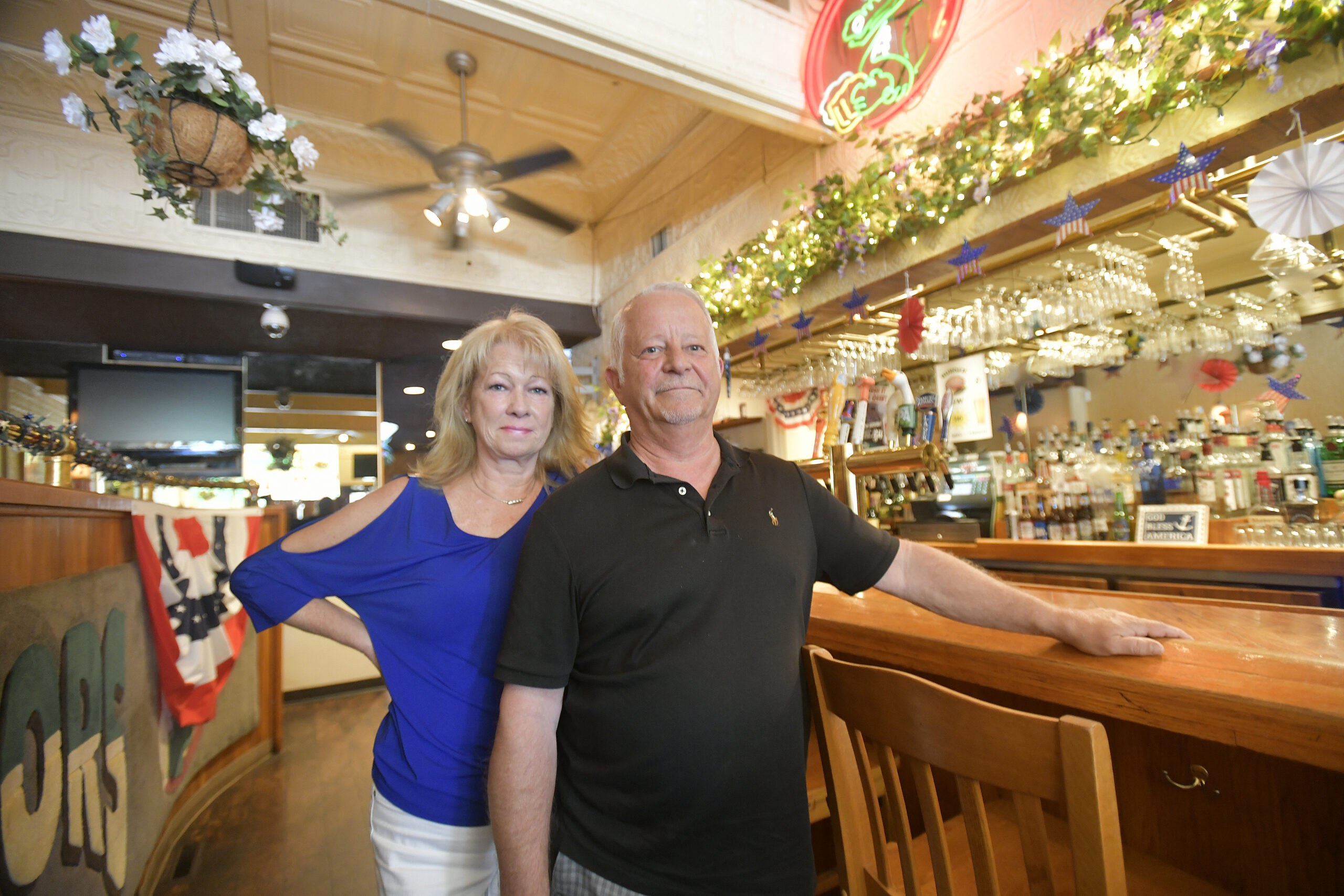 Diane and Richard Gise at the bar in Gators in Hampton Bays.  DANA SHAW
