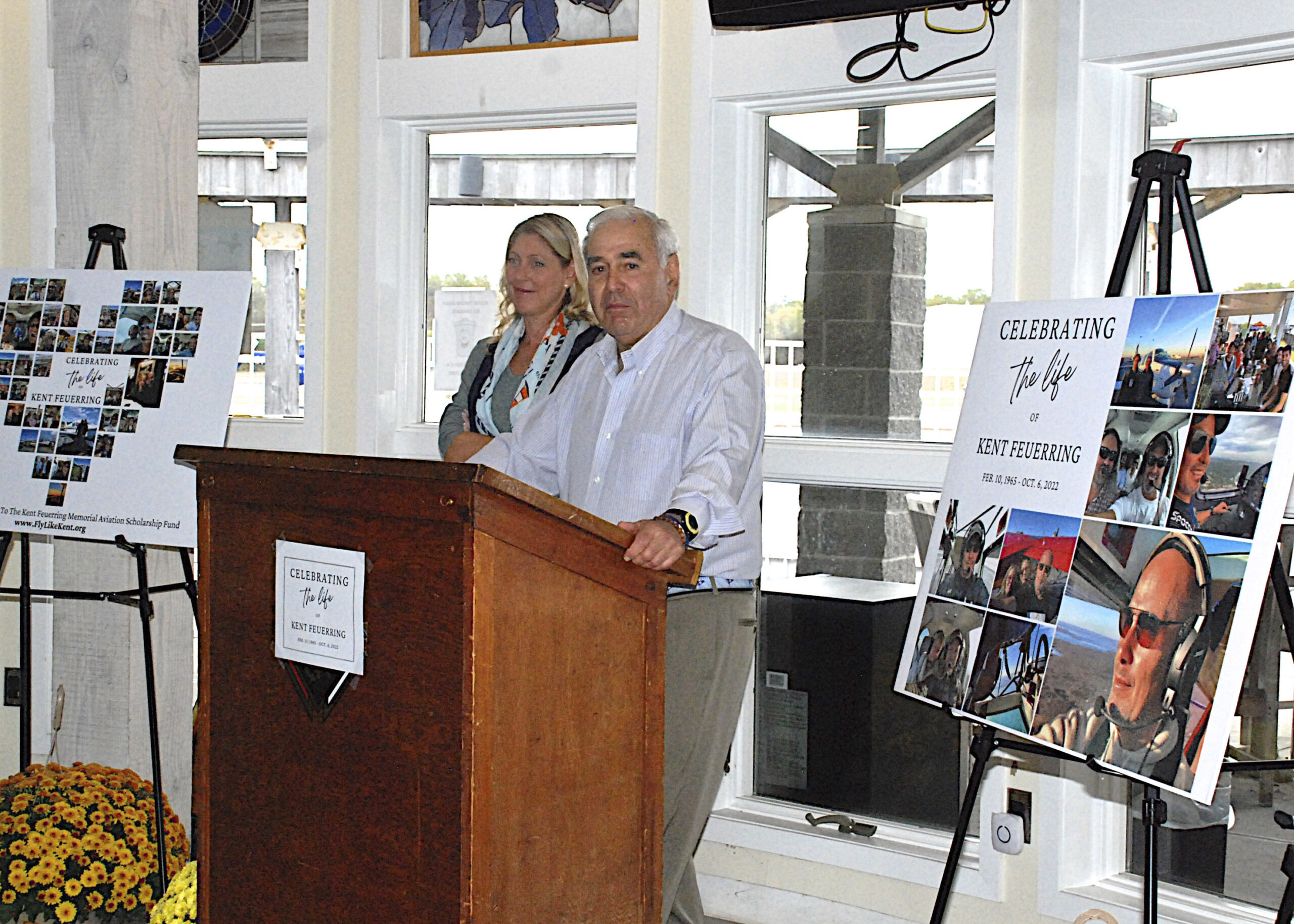 Andy Sabin speaks at the celebration of life at East Hampton Airport on Saturday morning for Kent Feuerring the pilot and president of the East End Aviation Association who was killed the crash of a small seaplane in Three Mile Harbor on October 6. Sabin pledged a $100,000 for a scholarship in Feuerring’s name.       KYRIL BROMLEY