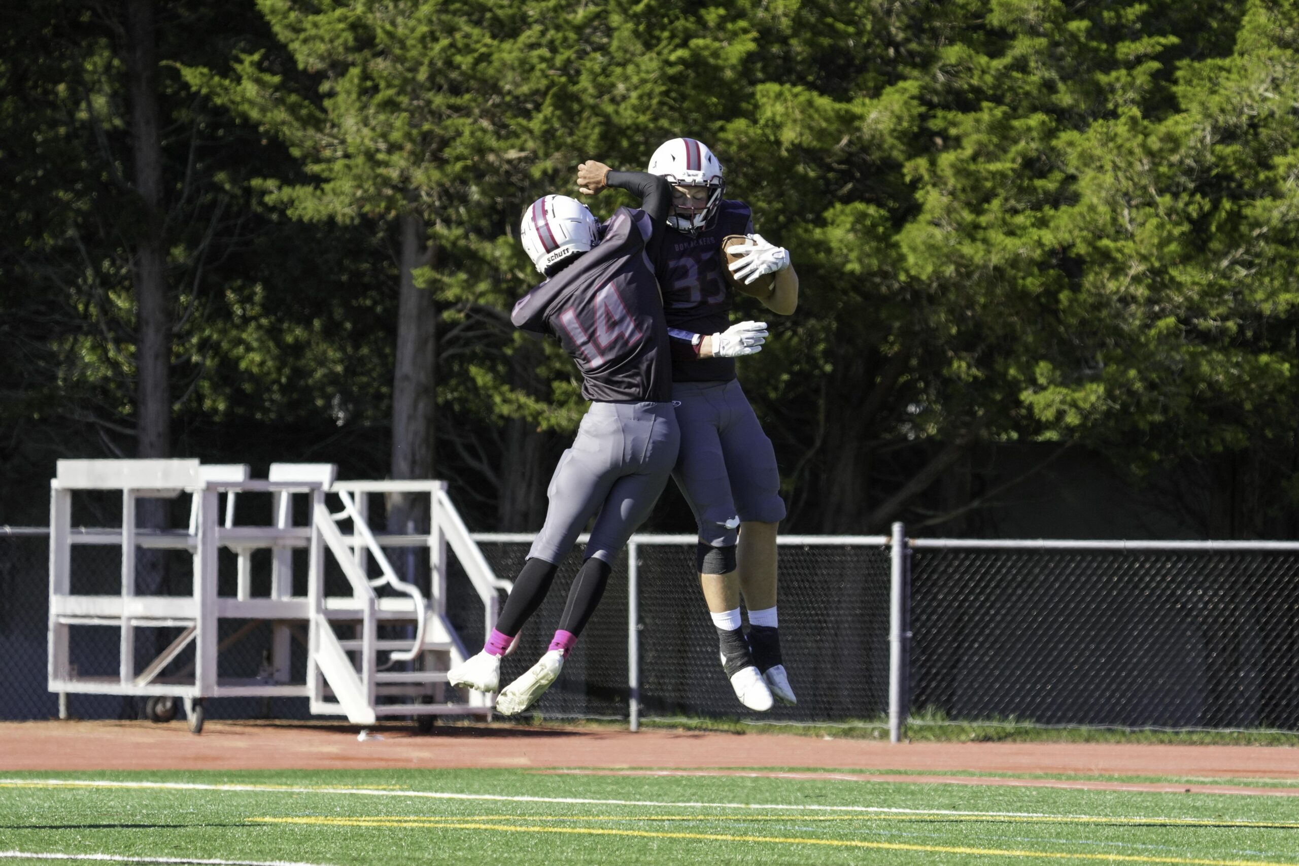 Aryan Chugh (14) celebrates with Will Darrell after his touchdown put East Hampton ahead.   RON ESPOSITO