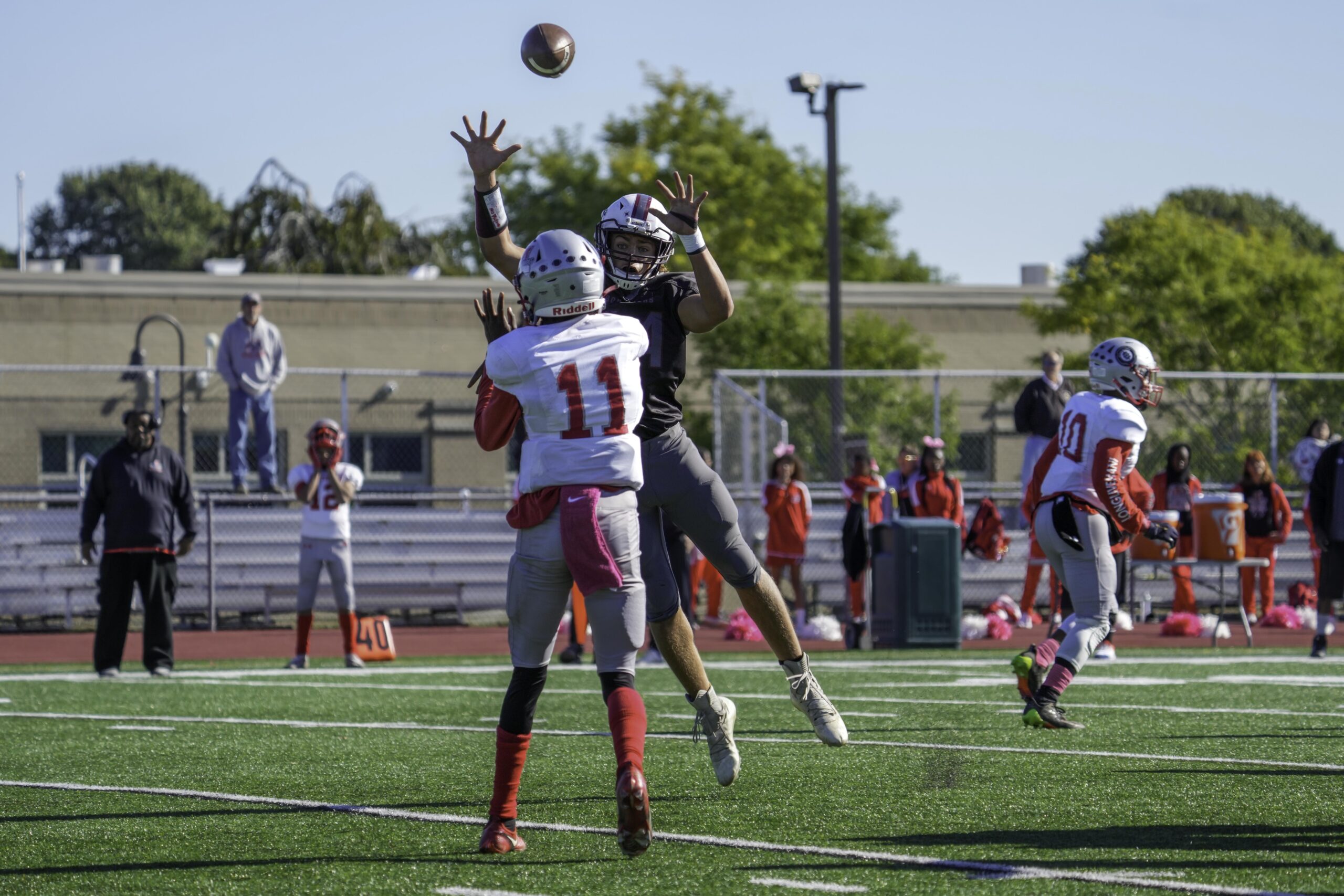 East Hampton's Richie Maio leaps to try and block a pass by Amityville's quarterback.    RON ESPOSITO