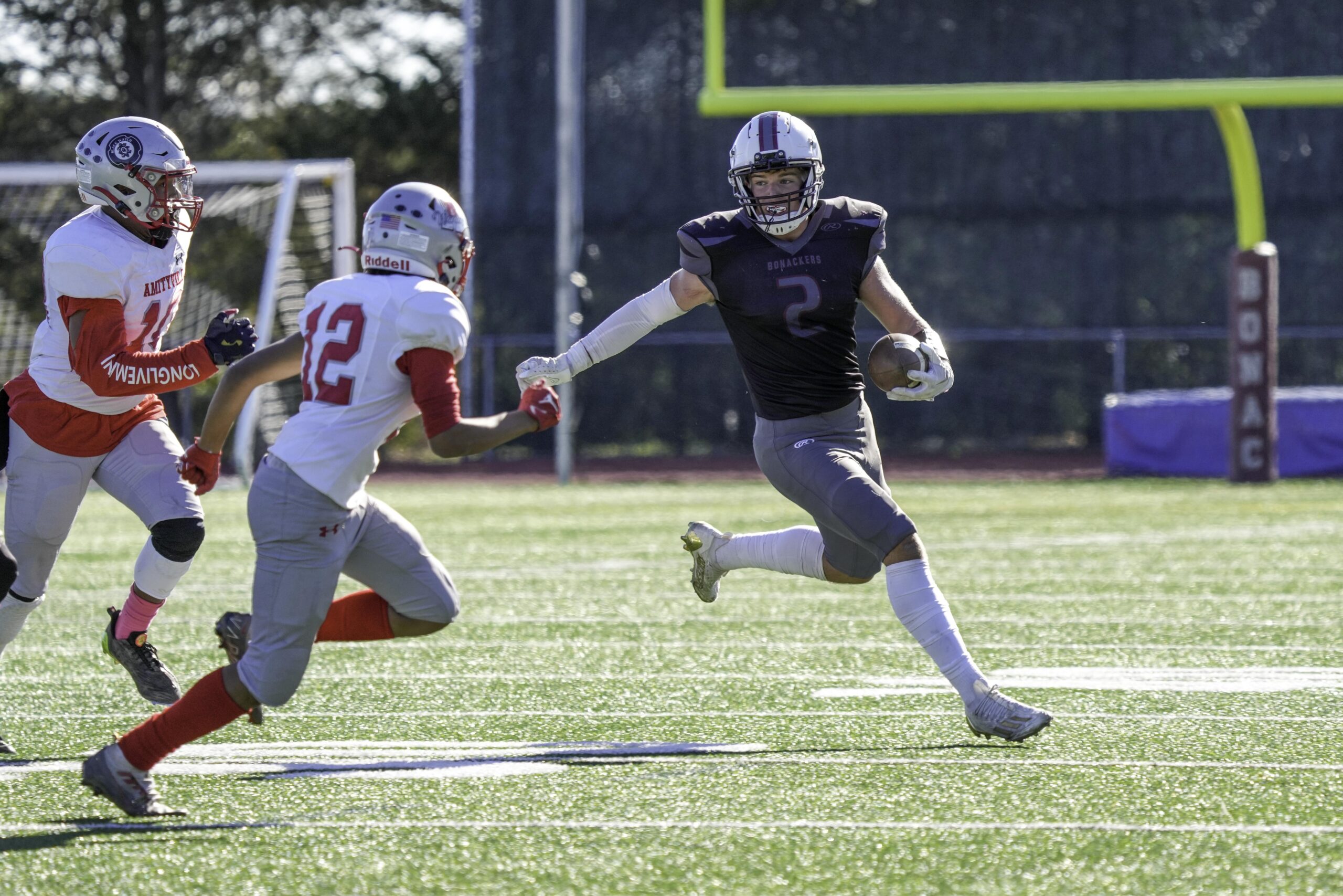 East Hampton senior running back Finn Byrnes looks for some open field.     RON ESPOSITO