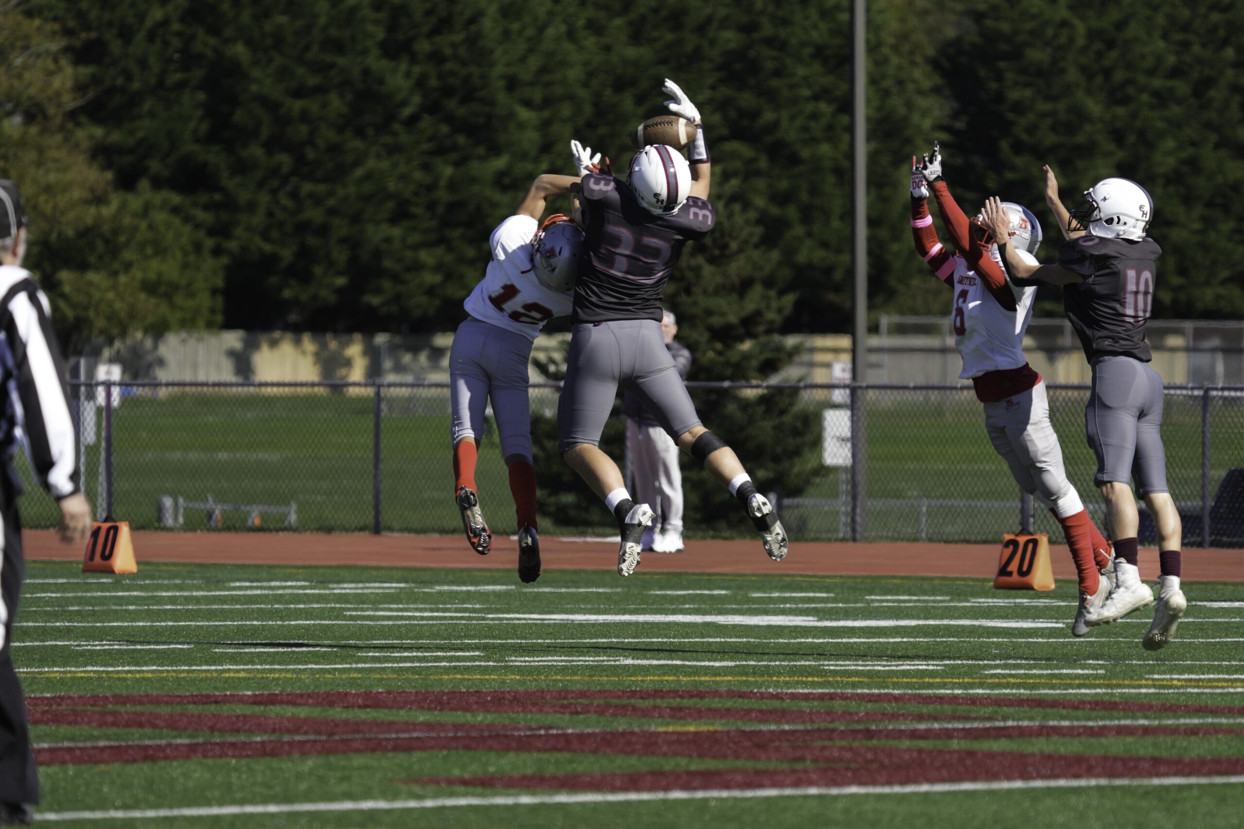 East Hampton tight end Will Darrell makes an acrobatic catch over an Amityville defender.   RON ESPOSITO