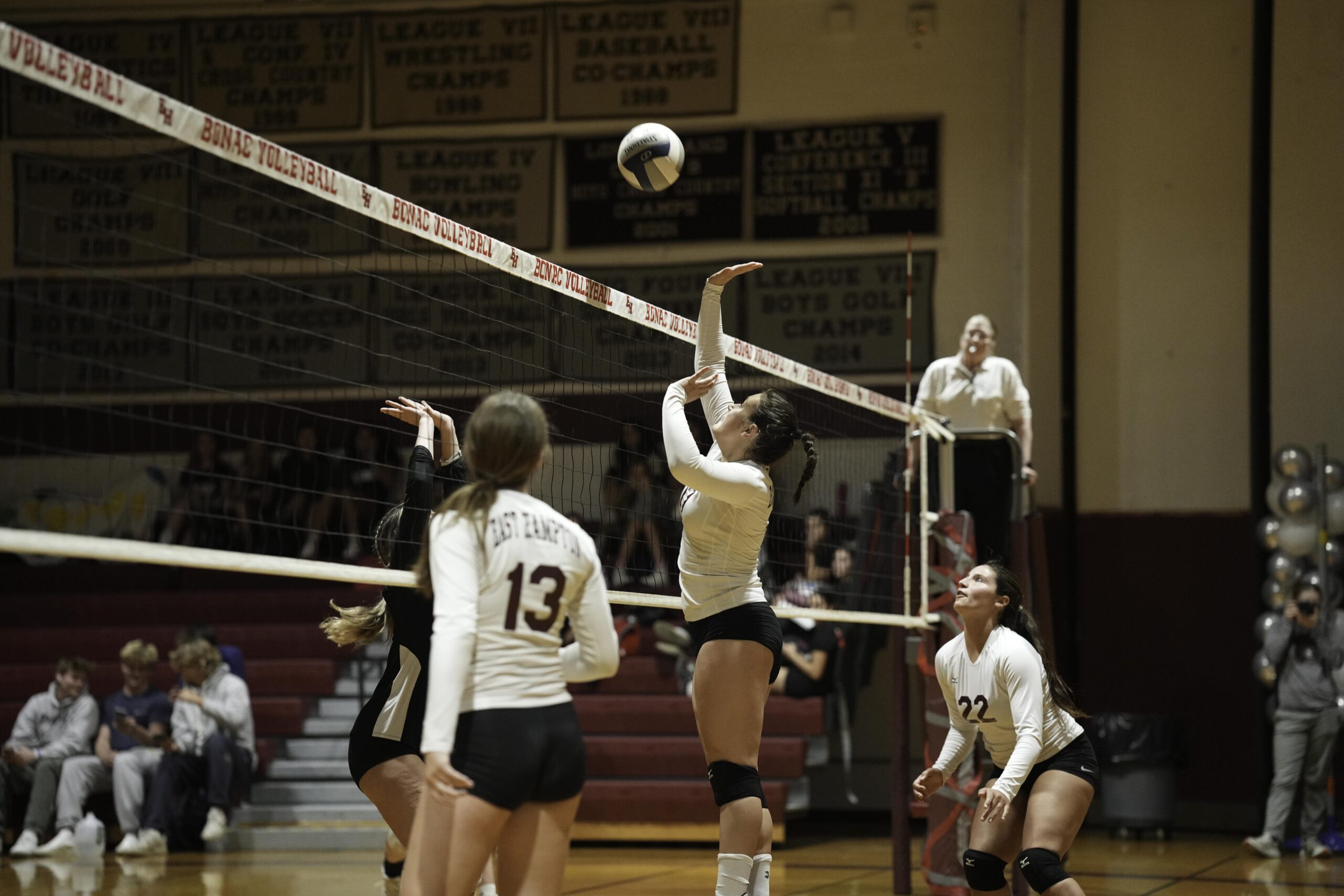 East Hampton junior Katie Kuneth plays the ball in the front row.    RON ESPOSITO