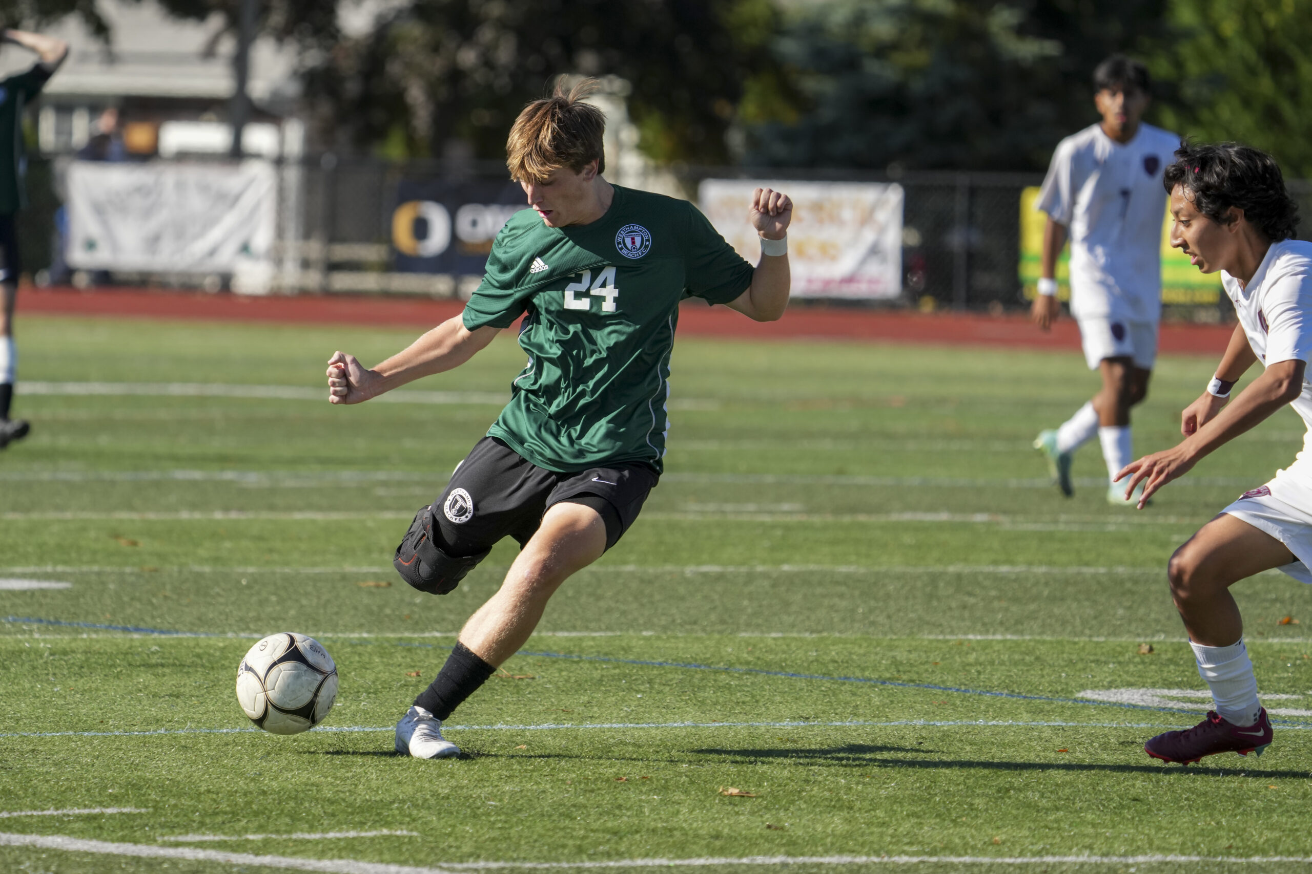 Westhampton Beach senior Chance Brindle clears the ball.    RON ESPOSITO