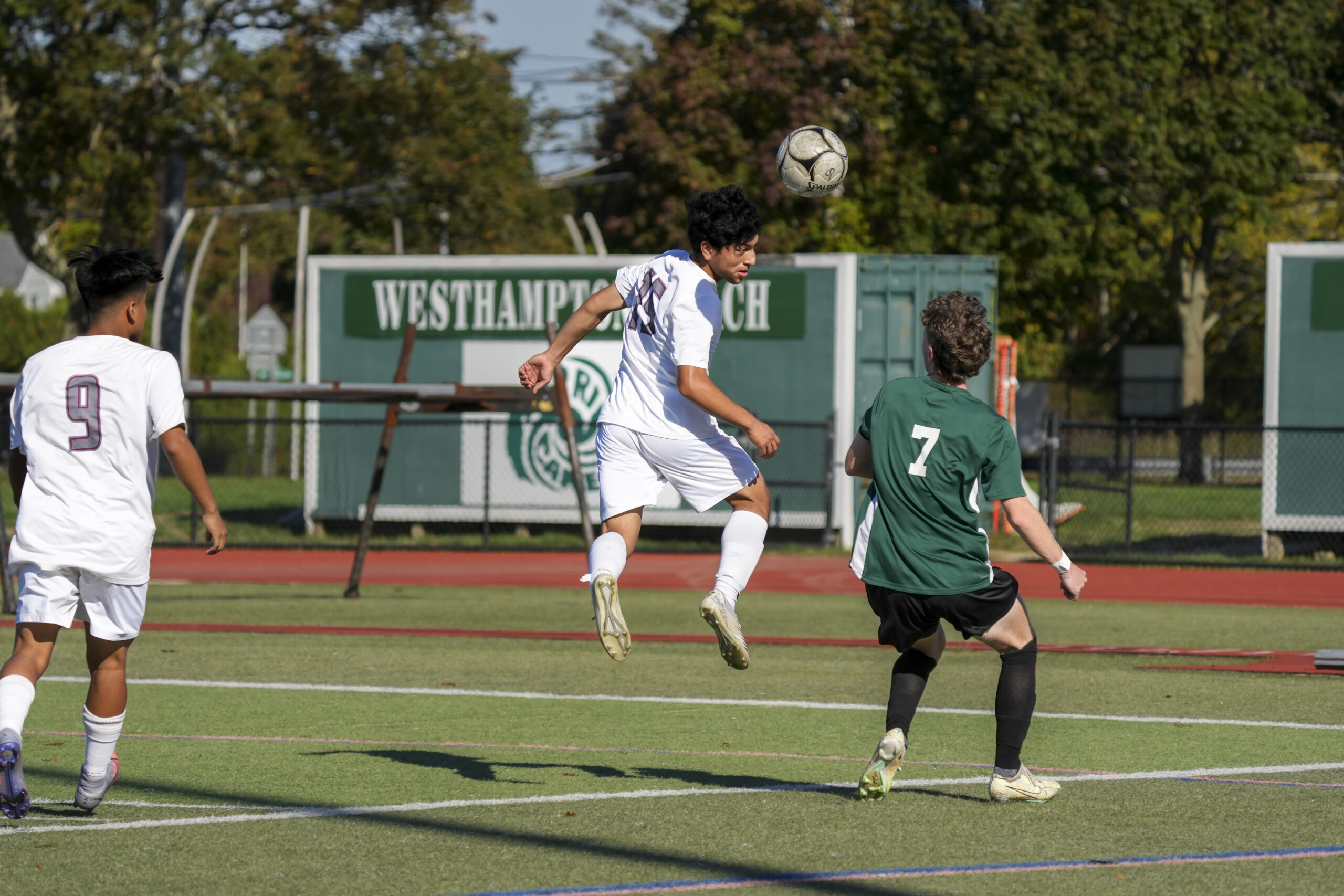 East Hampton junior David Armijos heads the ball forward.    RON ESPOSITO