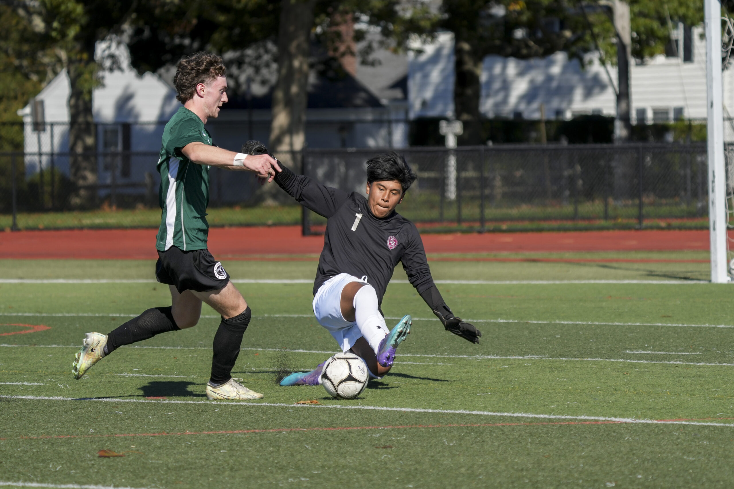 East Hampton junior goalie Nicholas Guerrero comes out to meet Westhampton Beach senior Ethan Vogt, who was able to dribble around him and score early in the first half.   RON ESPOSITO