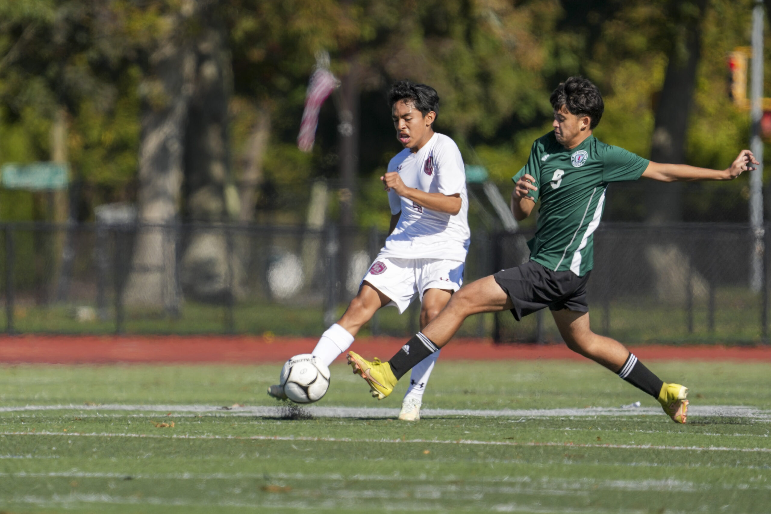 East Hampton sophomore Jonathan Armijos clears the ball before Westhampton Beach junior Randel Osorio can get to him.    RON ESPOSITO