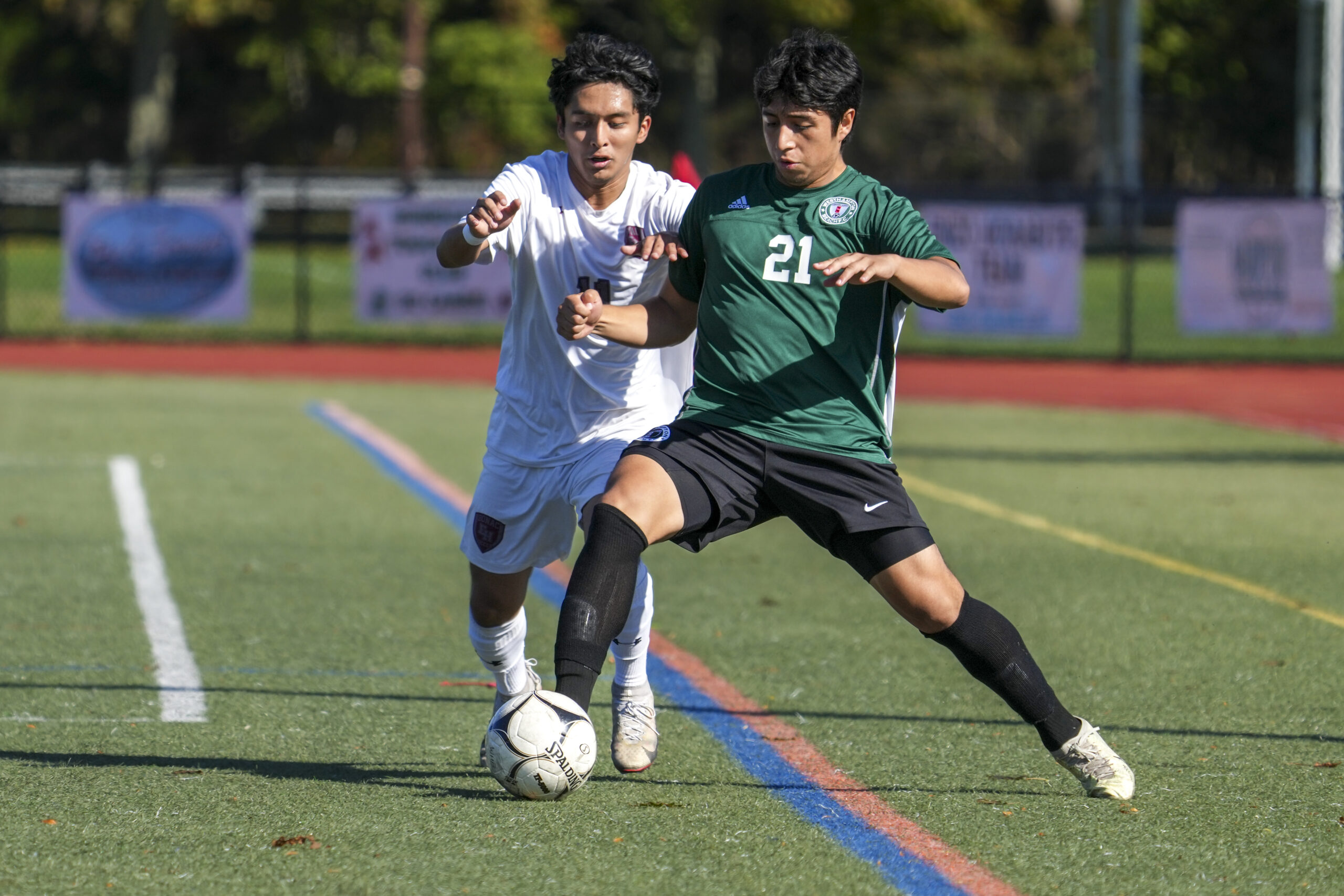 East Hampton junior Gary Gutama disrupts Westhampton Beach senior Alex Espana.    RON ESPOSITO