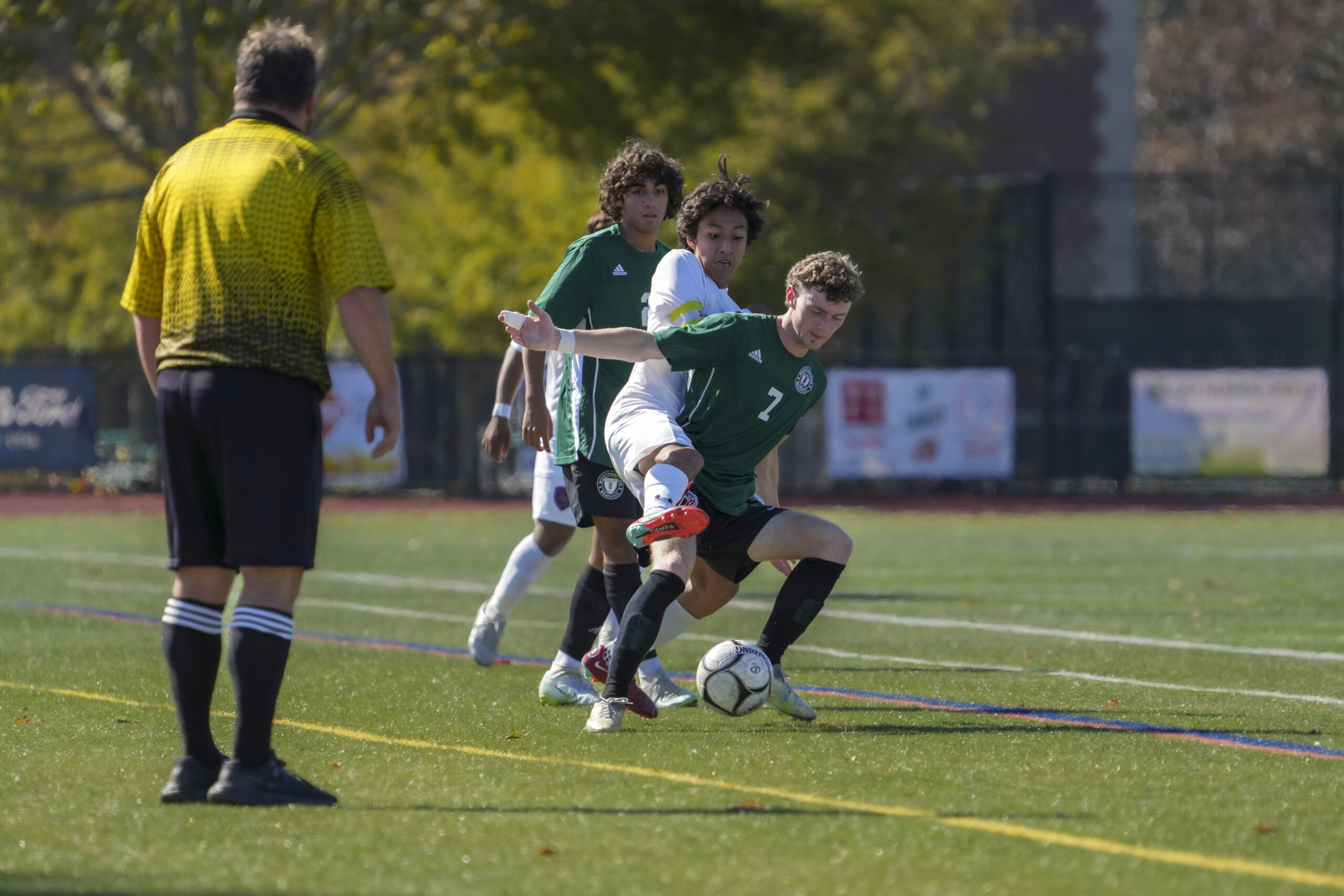 East Hampton junior co-captain Brian Tacuri gets tangled up with Westhampton Beach senior co-captain Ethan Vogt.    RON ESPOSITO