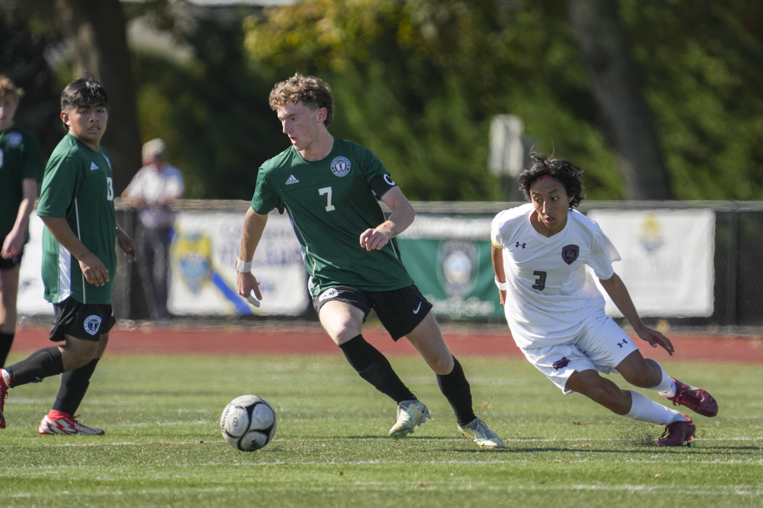 Westhampton Beach senior co-captain Ethan Vogt dribbles with East Hampton co-captain Brian Tacuri on his tail.    RON ESPOSITO