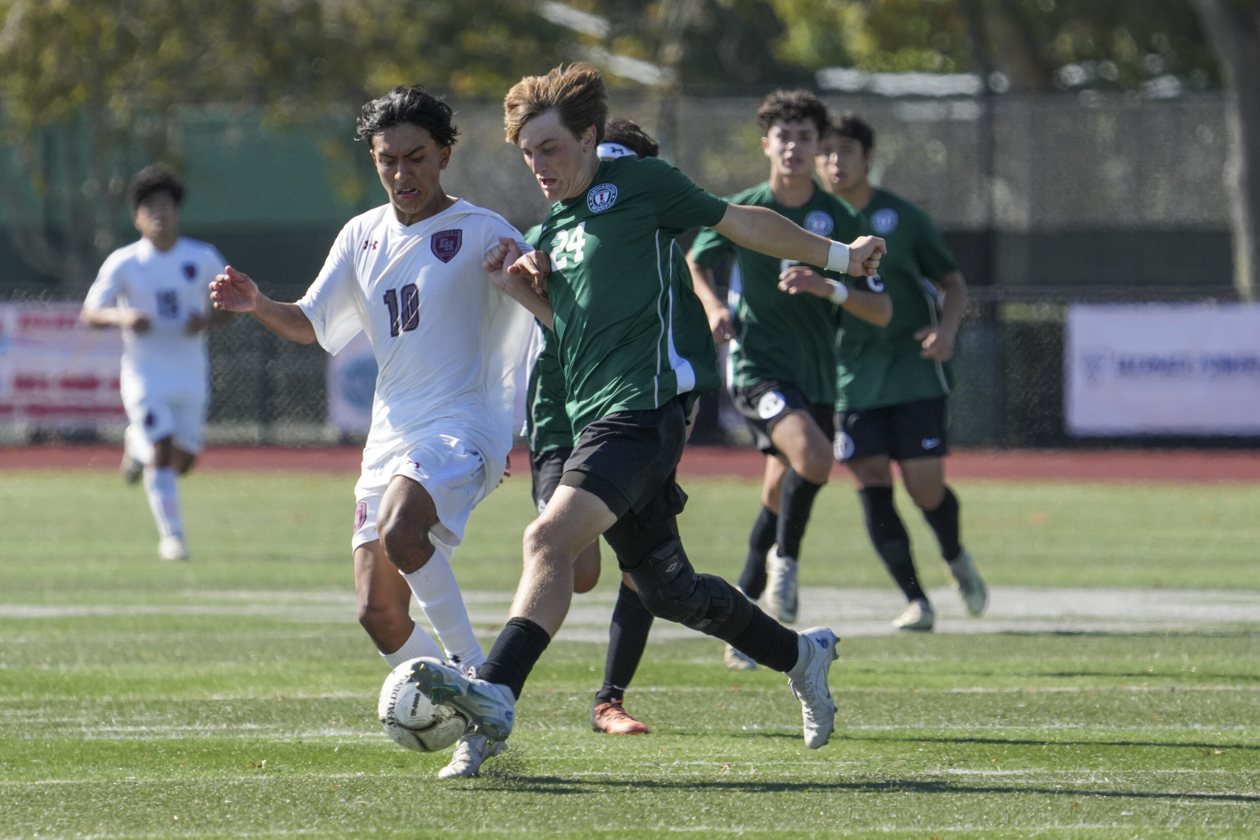 Westhampton Beach senior Chance Brindle pressures East Hampton senior co-captain Eric Armijos.    RON ESPOSITO