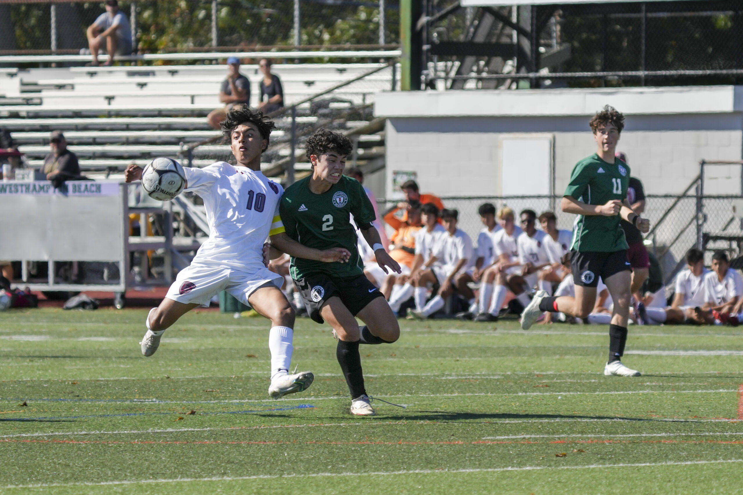 Westhampton Beach senior co-captain Amner Rosales tries to disrupt East Hampton senior co-captain Eric Armijos before he can get a shot off.    RON ESPOSITO