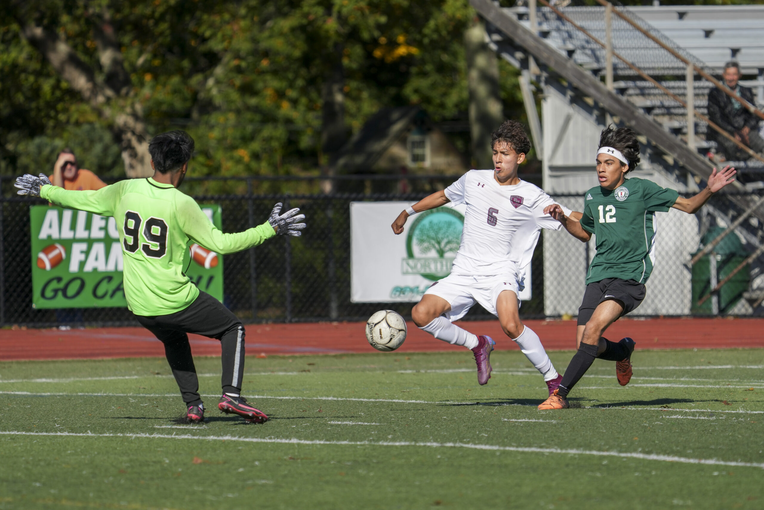 Westhampton Beach senior goalie Alex Ajiatax comes out to meet East Hampton junior John Bustamante who is being pressured by Westhampton Beach senior Jean Carlo Escobar.    RON ESPOSITO