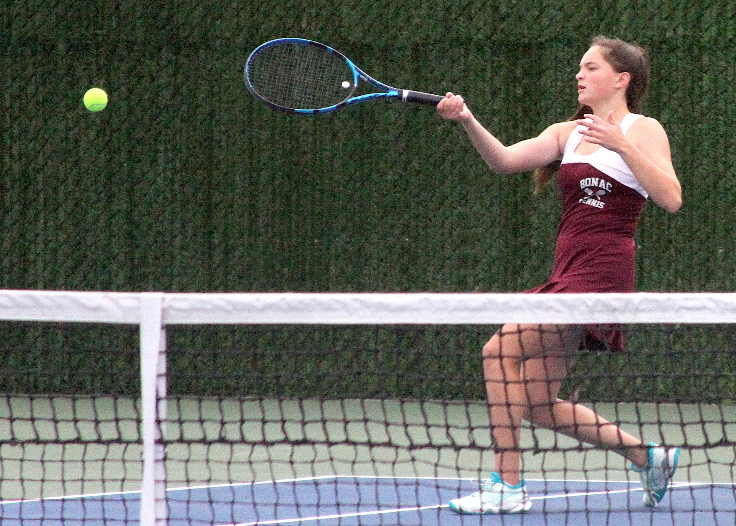 East Hampton senior Riley Roesel sends the ball back over the net. DESIRÉE KEEGAN