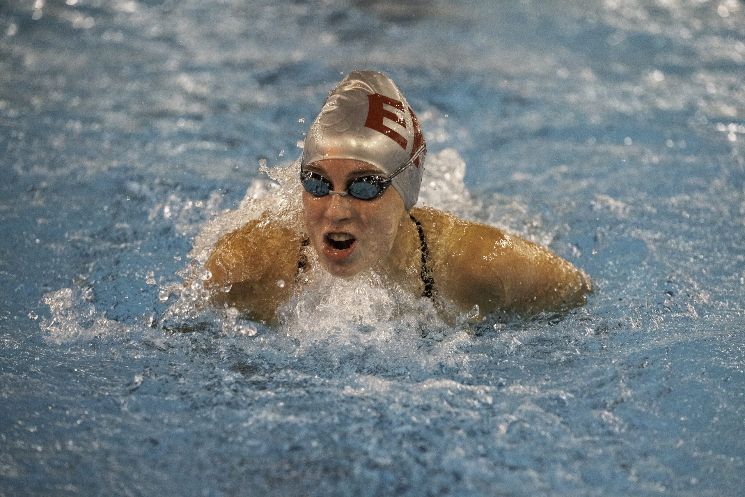 East Hampton senior Jane Brierley races in the 100-yard butterfly. RON ESPOSITO