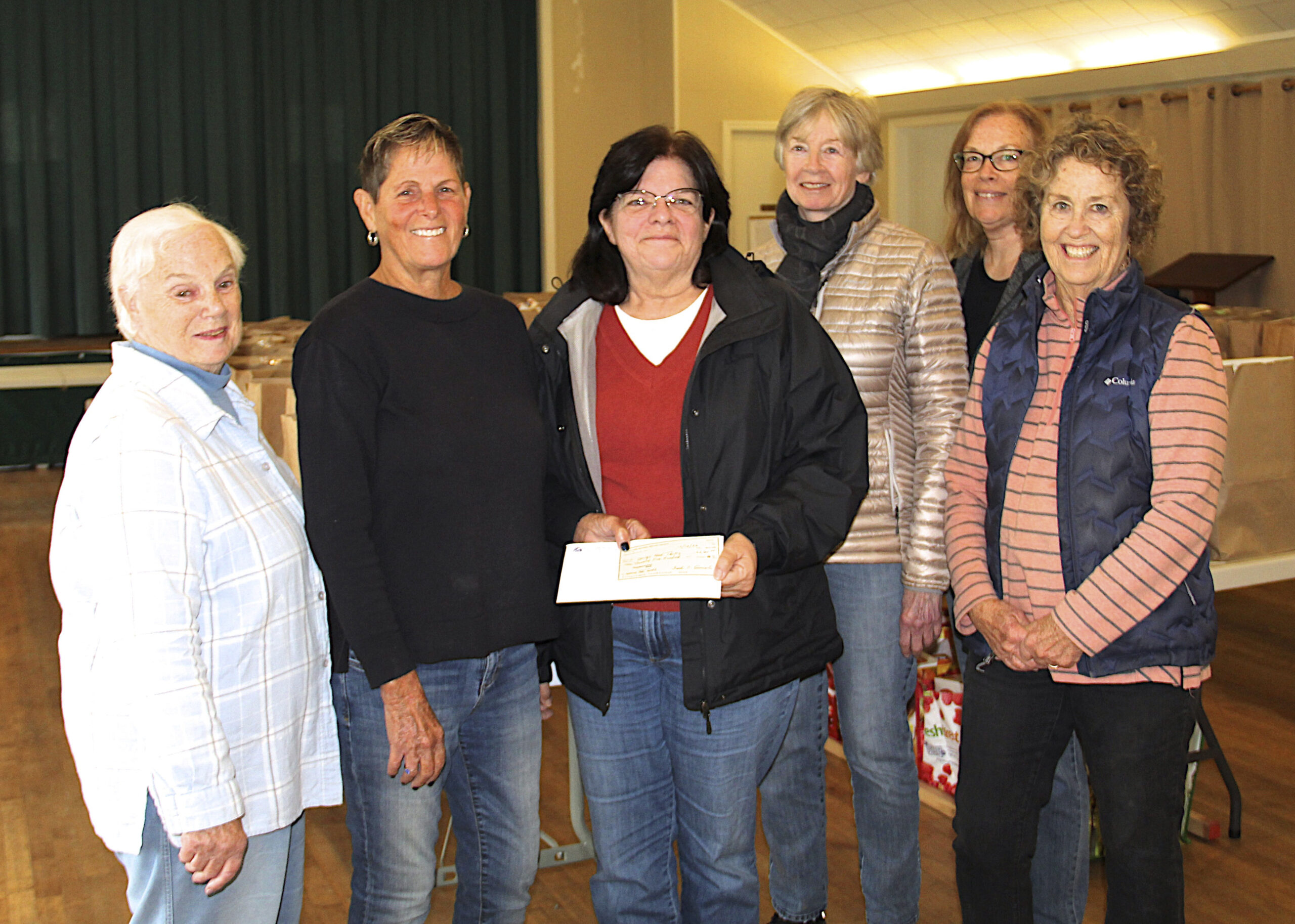 The South Fork Natural History Museum donated $2500 check, proceeds from part of their farm-to-table community program, to the Springs Food Pantry on October 18 at the Springs Church. Left to right are: Deanna Tikkanen, Holly Wheaton, Melanie Meade, Pamela Bicket, Carol Distler and Anne McCann.  KYRIL BROMLEY