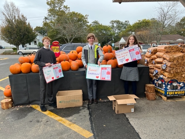 Our Lady of the Hamptons School Prep 8 students Kyleigh Whitney, Henry Springer and Tristan Fortelni recently collected  items for the local pantry. COURTESY OUR LADY OF THE HAMPTONS SCHOOL