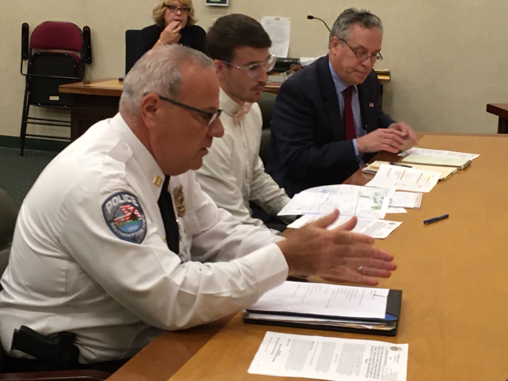 Captain James Kiernan, Town Engineer Thomas Houghton, and traffic consultant Thomas Neely discuss the blinking light program.   KITTY MERRILL