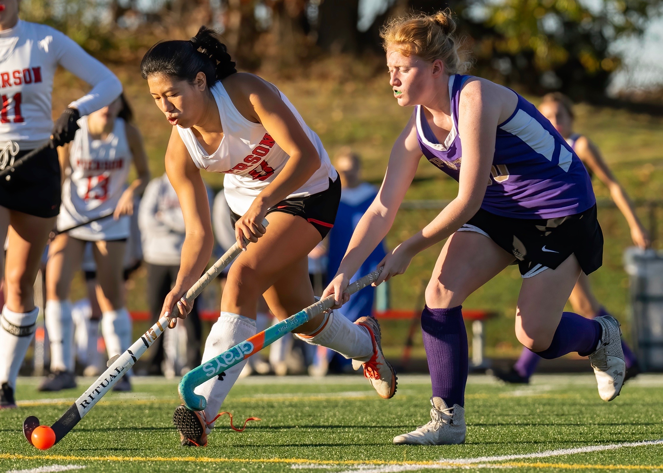 Maddie Cohen maintains possession with a defender on her hip. MARIANNE BARNETT