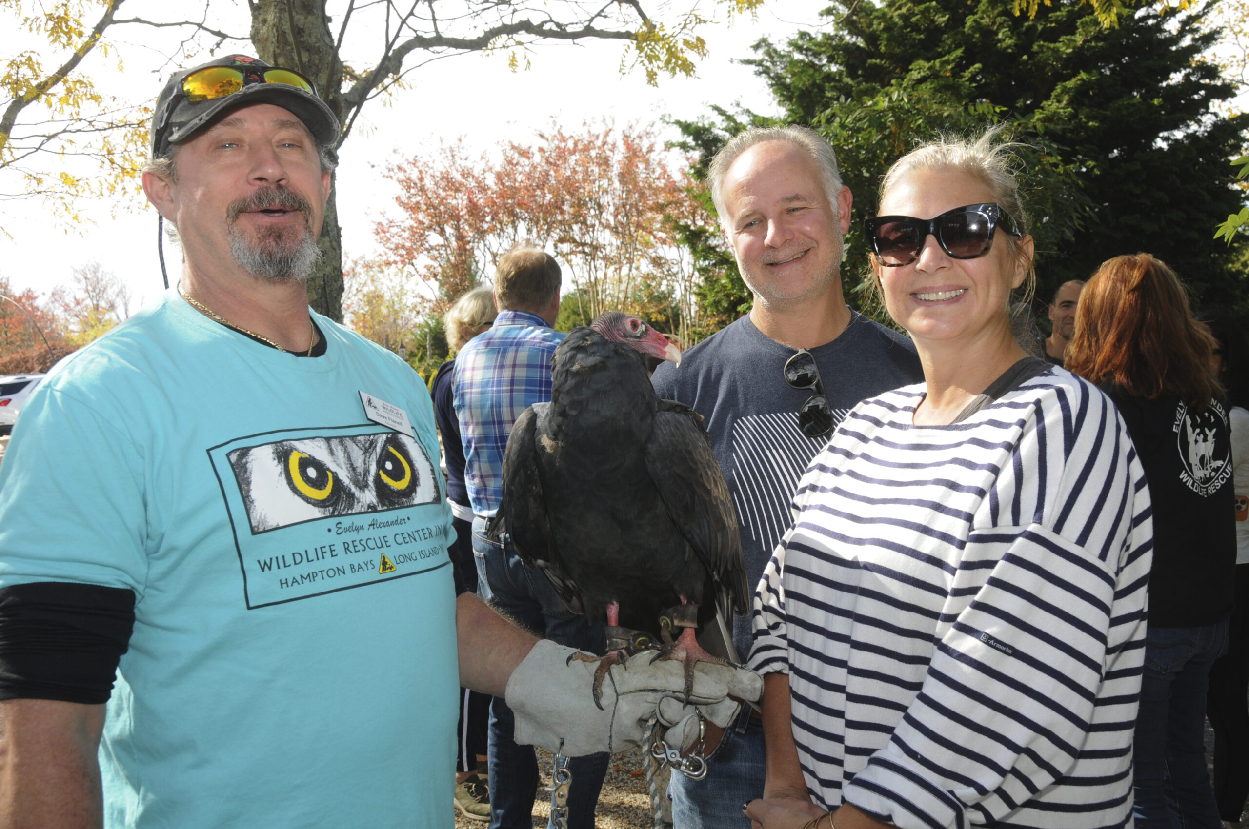 Dave Flanell with Vlad, a turkey vulture, and Doug and Amy Magnolia at Marders in Bridgehampton on Sunday to meet some of the animal ambassadors from the Evelyn Alexander Wildlife Rescue Center.  RICHARD LEWIN