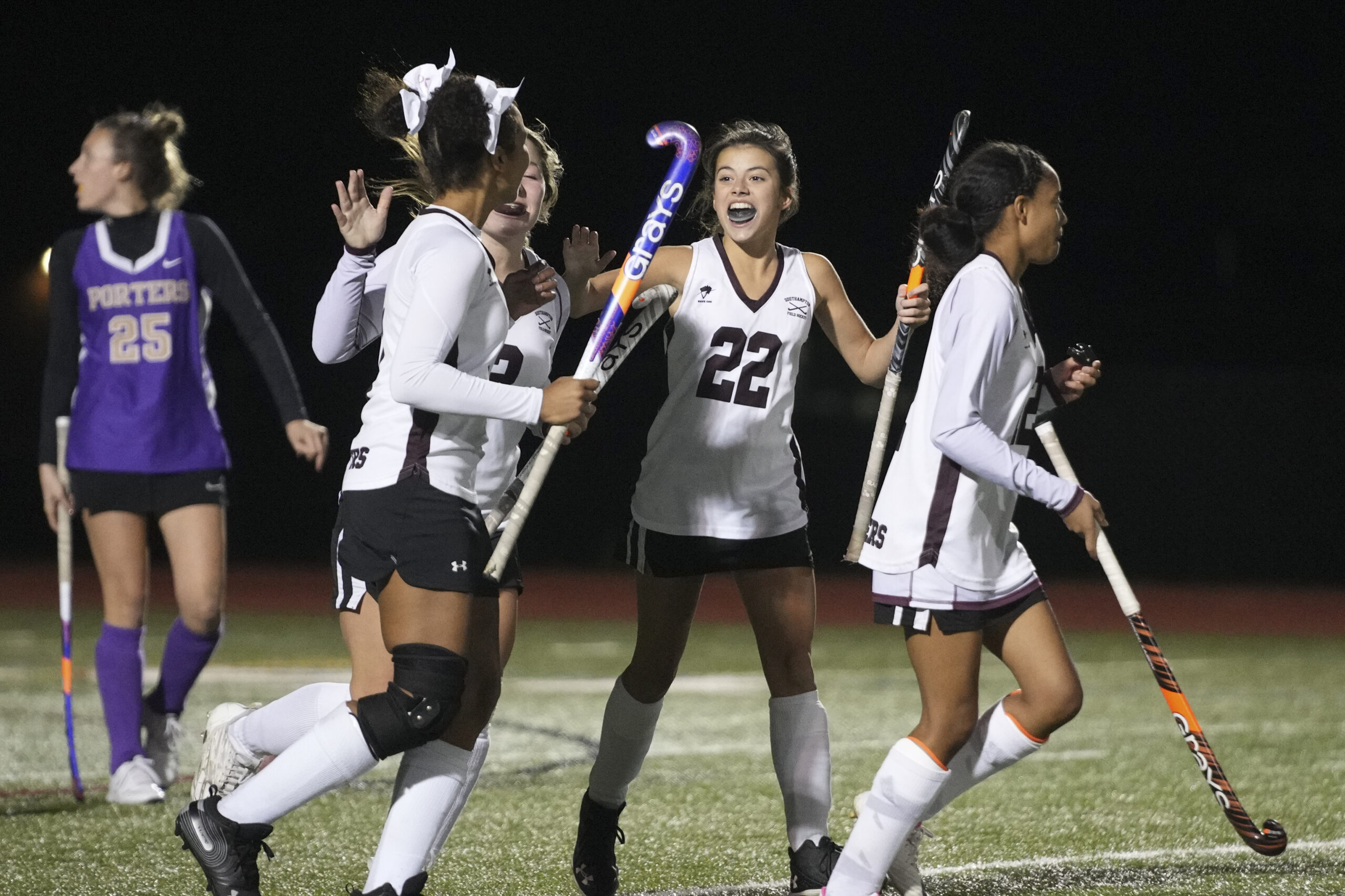 Emma Suhr (22) and the Mariners are all smiles after scoring a goal.   RON ESPOSITO