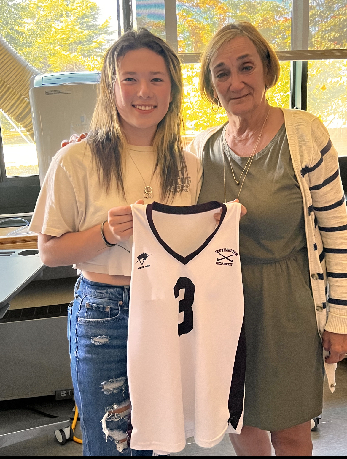 Southampton High School’s fall athletes recently demonstrated their appreciation to staff members who have positively influenced them by asking Varsity field hockey player Chloe Phillips presented her jersey to Roseann Gentile, Southampton Intermediate School play director and senior office assistant. COURTESY SOUTHAMPTON SCHOOL DISTRICT