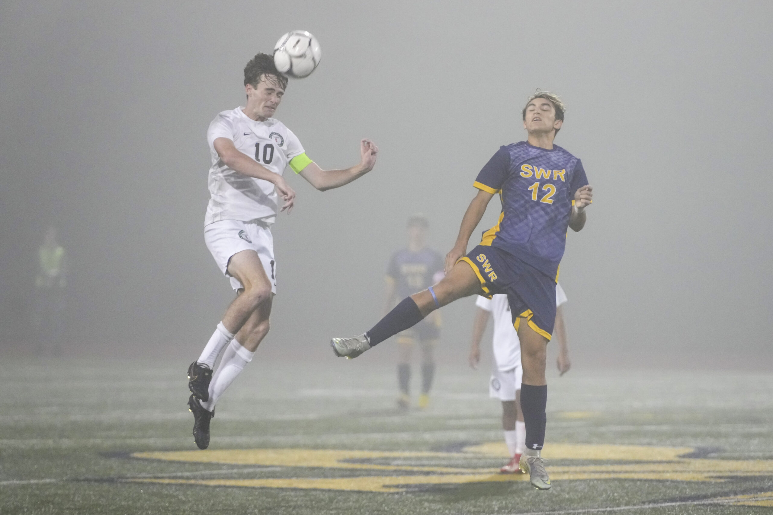 Westhampton Beach senior co-captain Kade Murphree heads the ball forward.    RON ESPOSITO