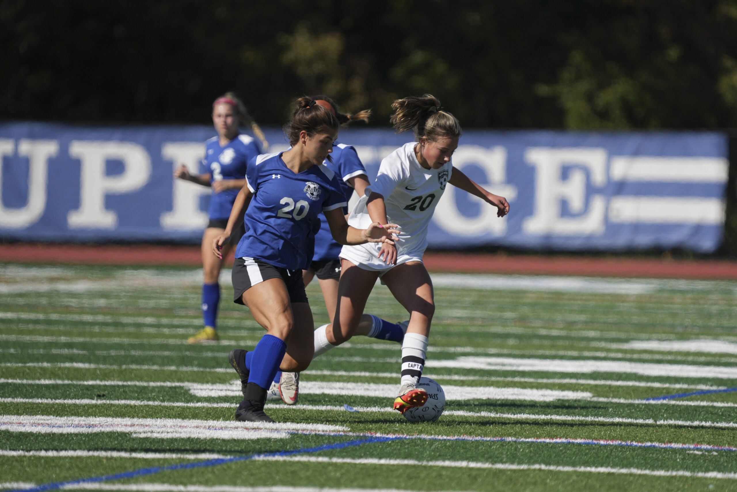 Westhampton Beach senior Amanda Shannon fends off a Hauppauge player.    RON ESPOSITO