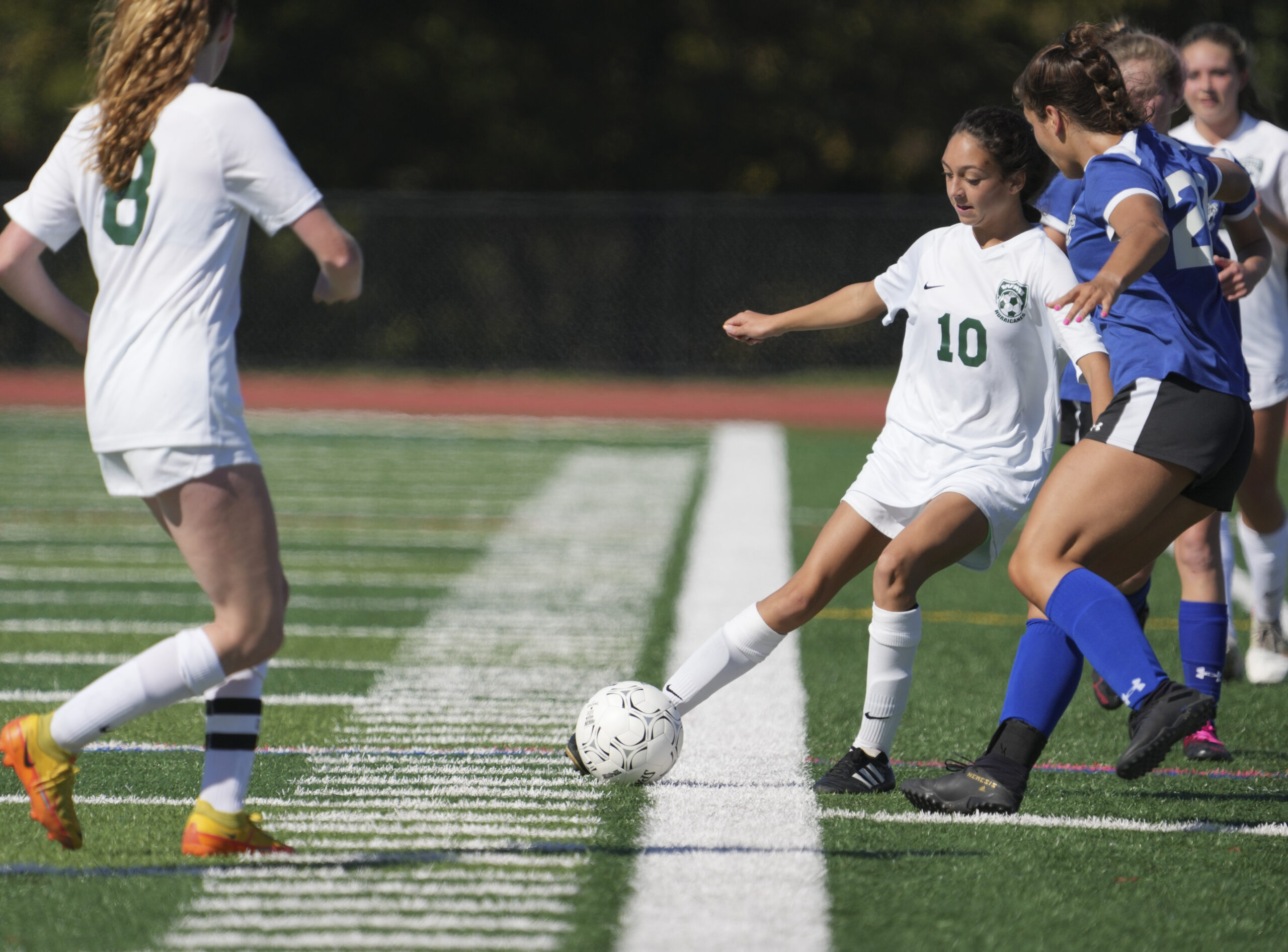 Westhampton Beach sophomore Mia Valenzuela passes to teammate Sarah Gormley.    RON ESPOSITO