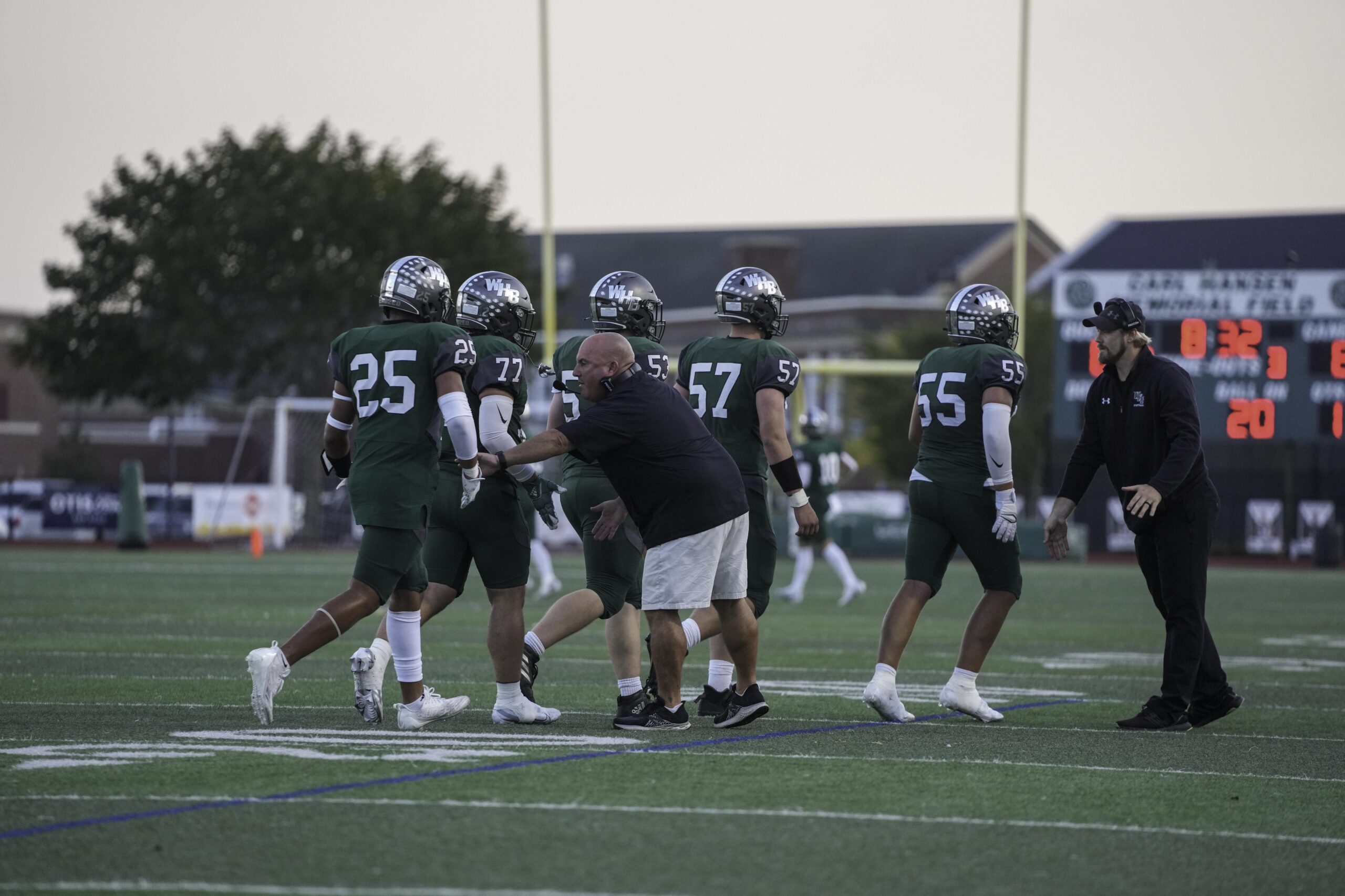 Westhampton Beach offensive coordinator Mark Johnson and assistant coach Cole Manger congratulate their players after scoring the game's first touchdown.   RON ESPOSITO