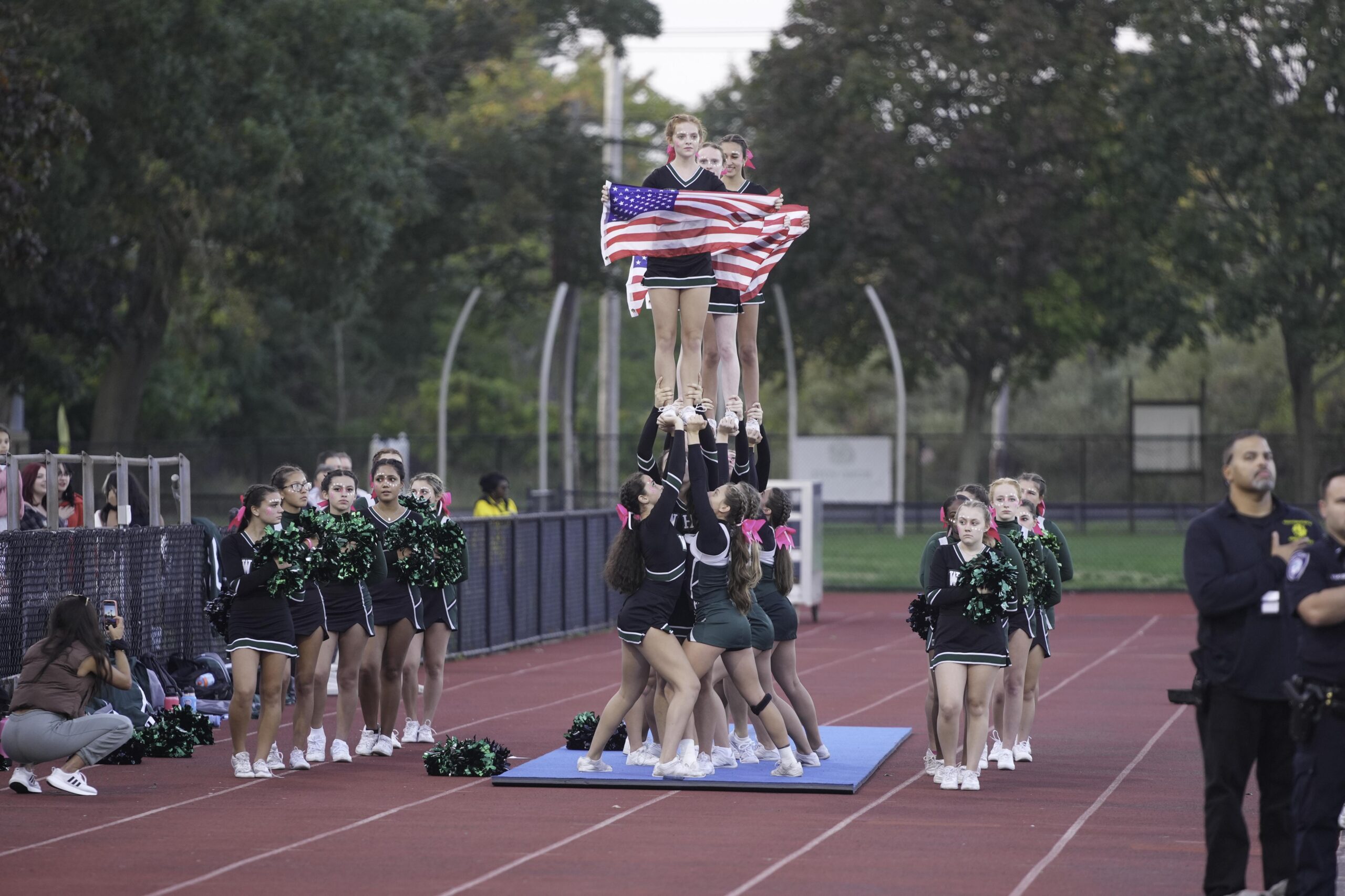 The Westhampton Beach cheerleaders during the national anthem.    RON ESPOSITO