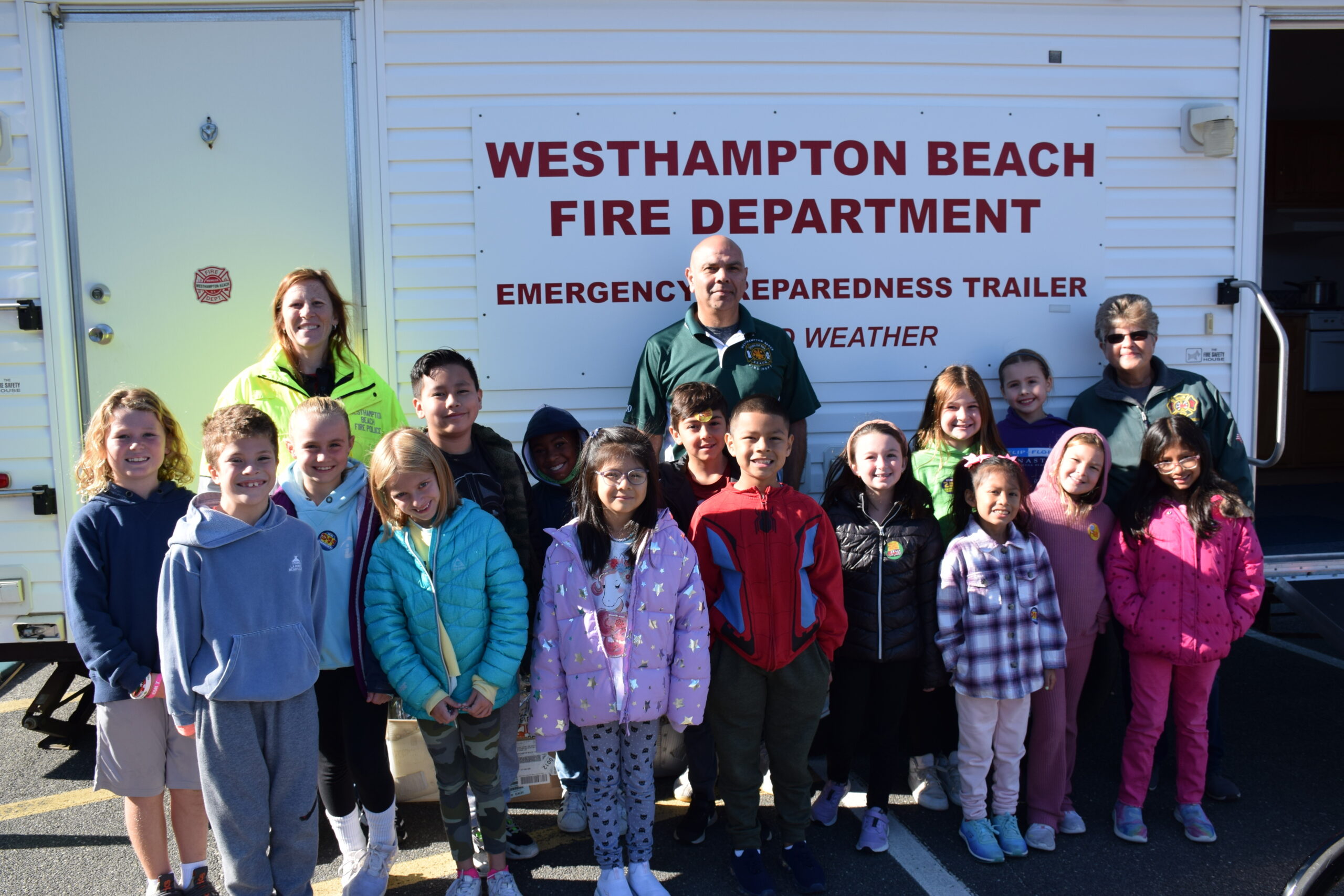 As part of Fire Prevention Week, Westhampton Beach Elementary School students participated in fire safety lessons with members of the Westhampton Beach Fire Department. Students learned about general fire safety, smoke alarms and fire extinguishers and practiced calling 911 and jumping out the window of the fire
department’s smoke house simulator.