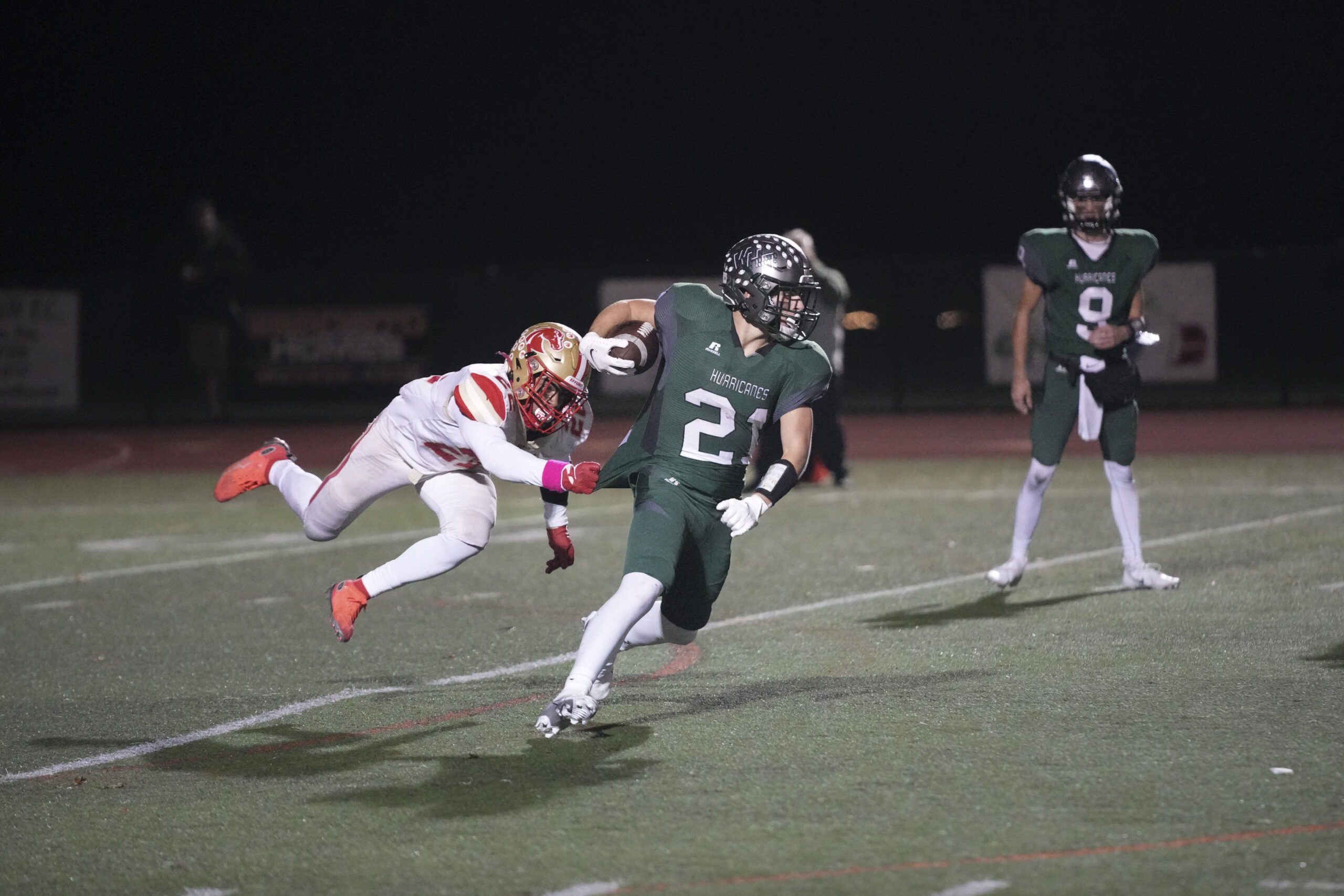 Westhampton Beach sophomore Brody Schaffer drags a Hills West defender behind.    RON ESPOSITO