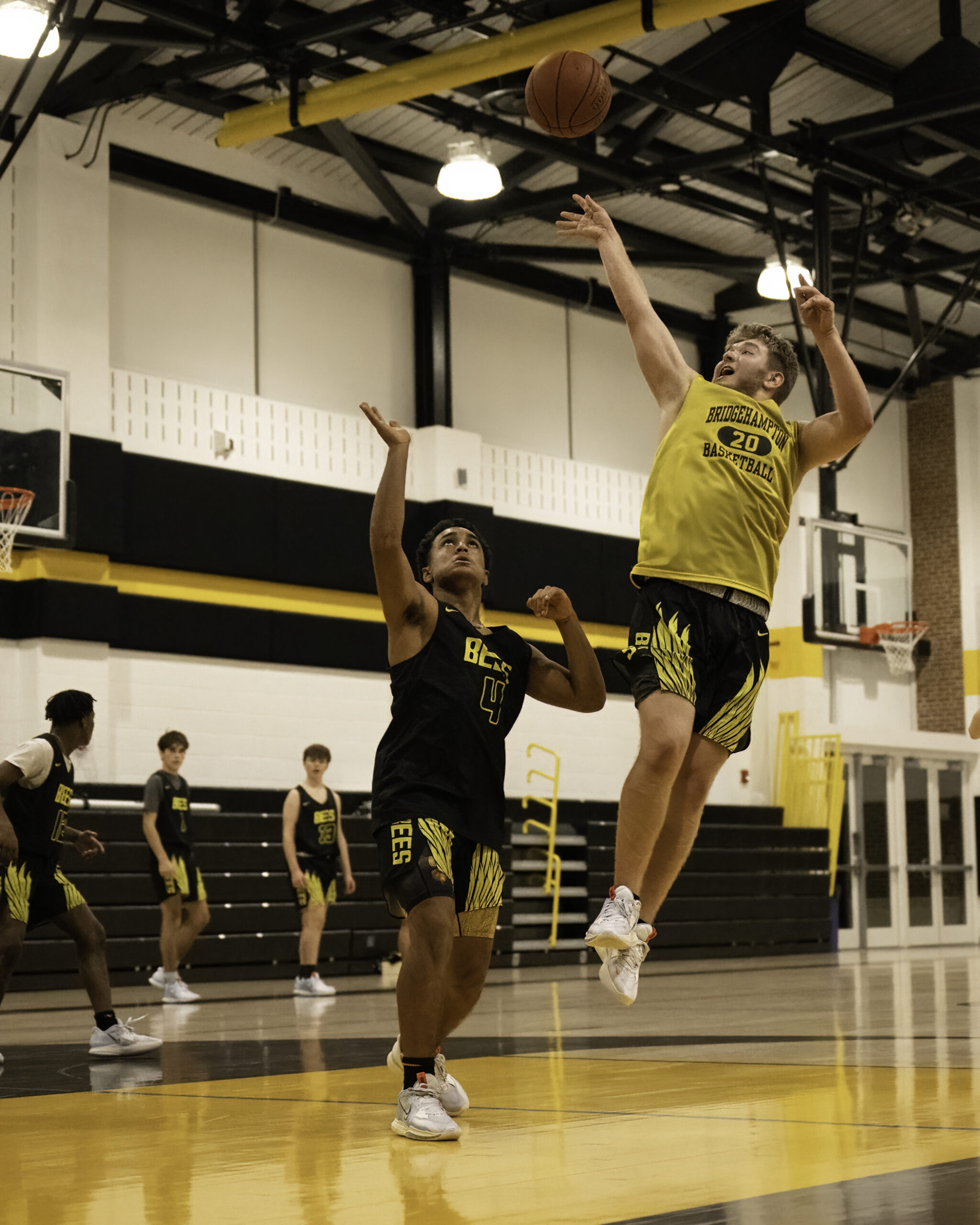 Bridgehampton senior Jack Boeshore shoots over freshman teammate Alex Davis in practice on Monday.    MARIANNE BARNETT