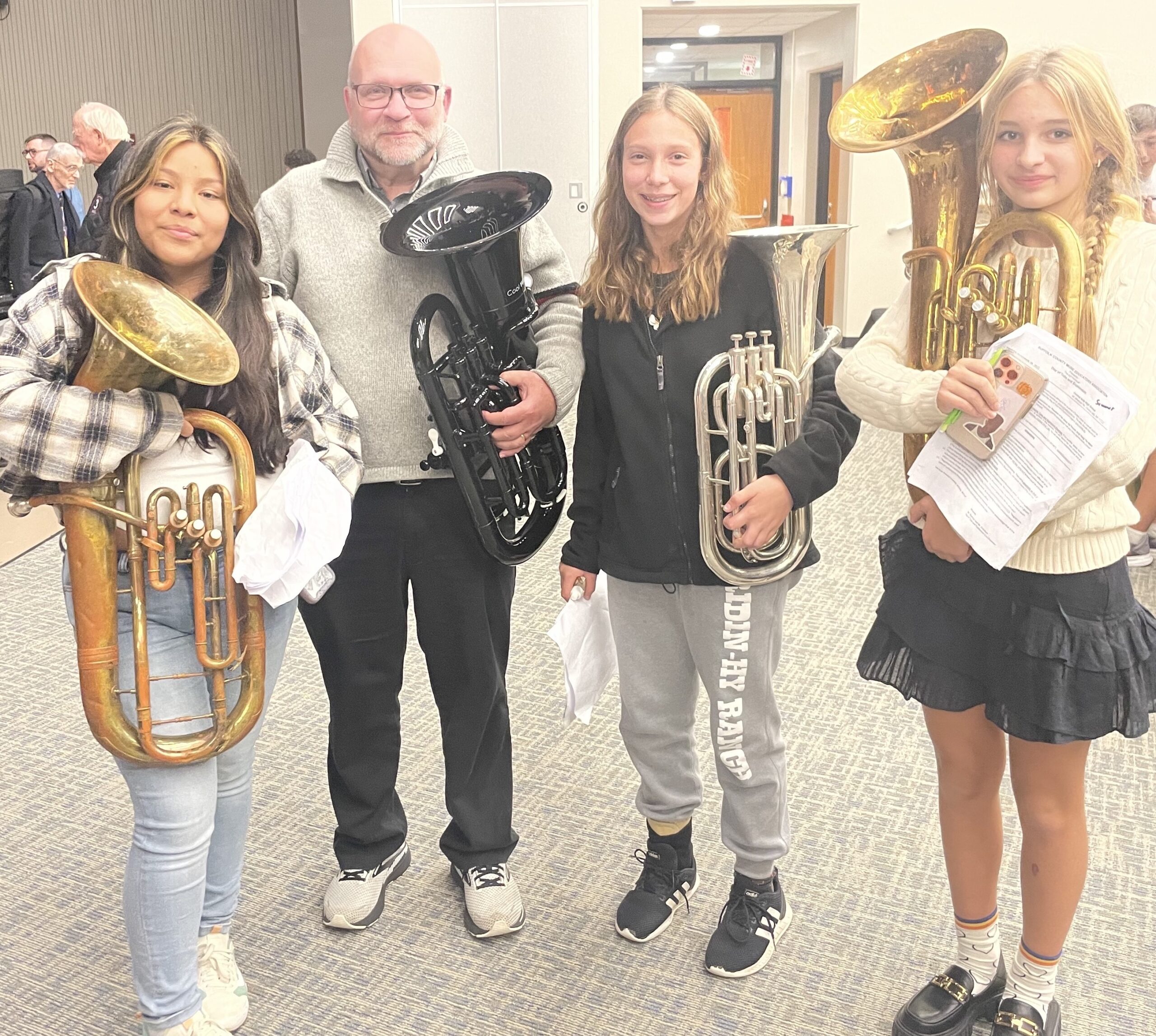 Three Bridgehampton School students represented the district’s music program at the Suffolk County Music Educators’ Day of Tuba and Euphonium, recently held at Central Islip High School. Students seventh-grader Yaredci Chavez, seventh-grader Kate Vinski, and eighth-grader Summer Lillie, accompanied by music teacher Dave Elliot, participated in rehearsals and clinics, culminating in a concert featuring guest artists the All-County Tuba-Euphonium Ensemble, the Faculty Ensemble, the Long Island Tuba Quartet and the Massed Tuba Ensemble. COURTESY BRIDGEHAMPTON SCHOOL DISTRICT