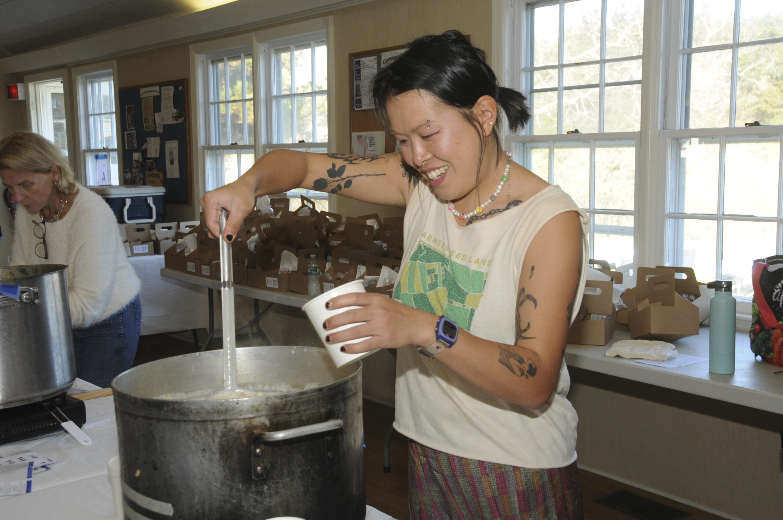 Mimi Song serves up chowder at the Springs Food Pantry's annual 