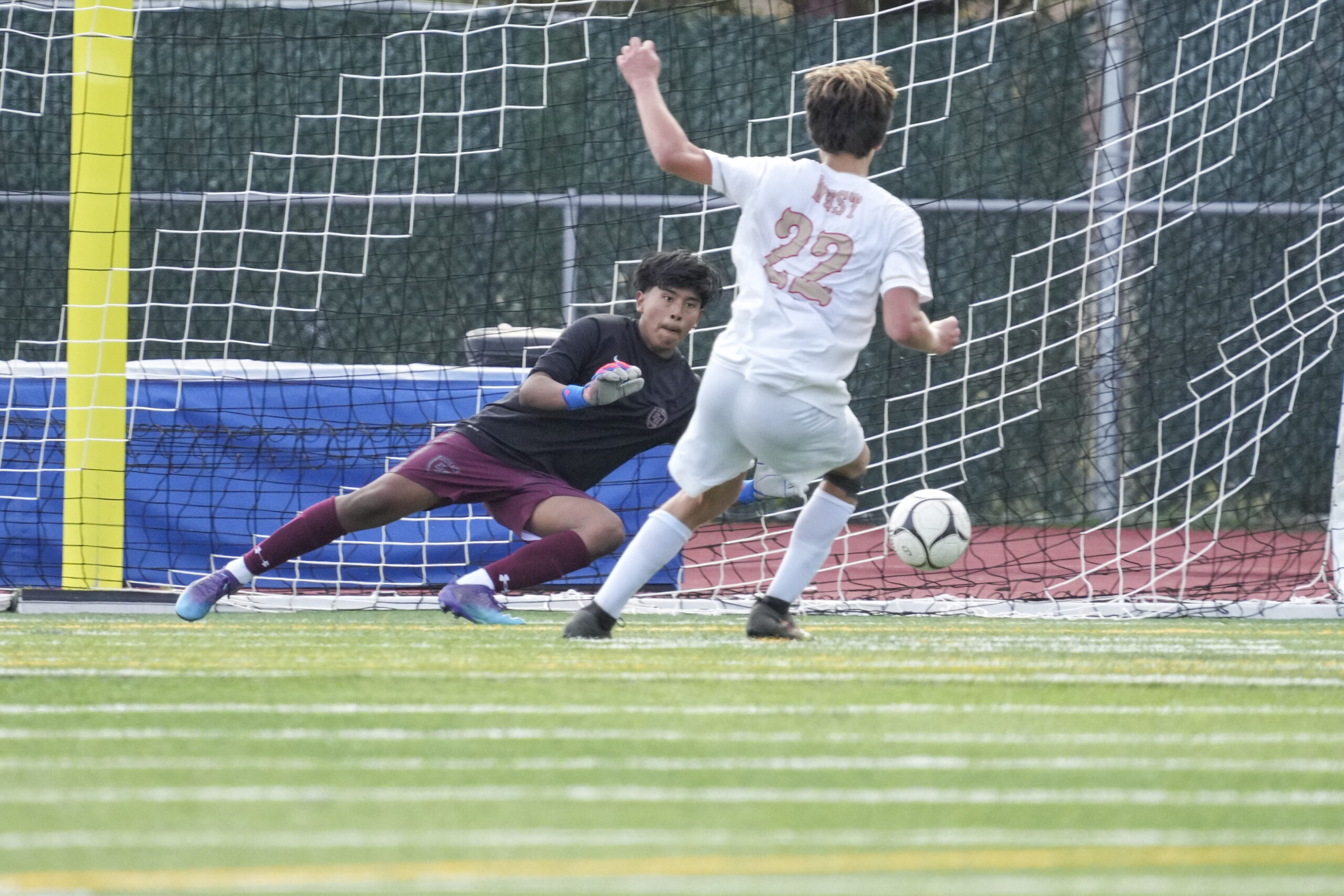 East Hampton junior goalie Nicholas Guerrero has a penalty kick in his sights. He made the save to keep the game at 1-0 in the second half.   RON ESPOSITO