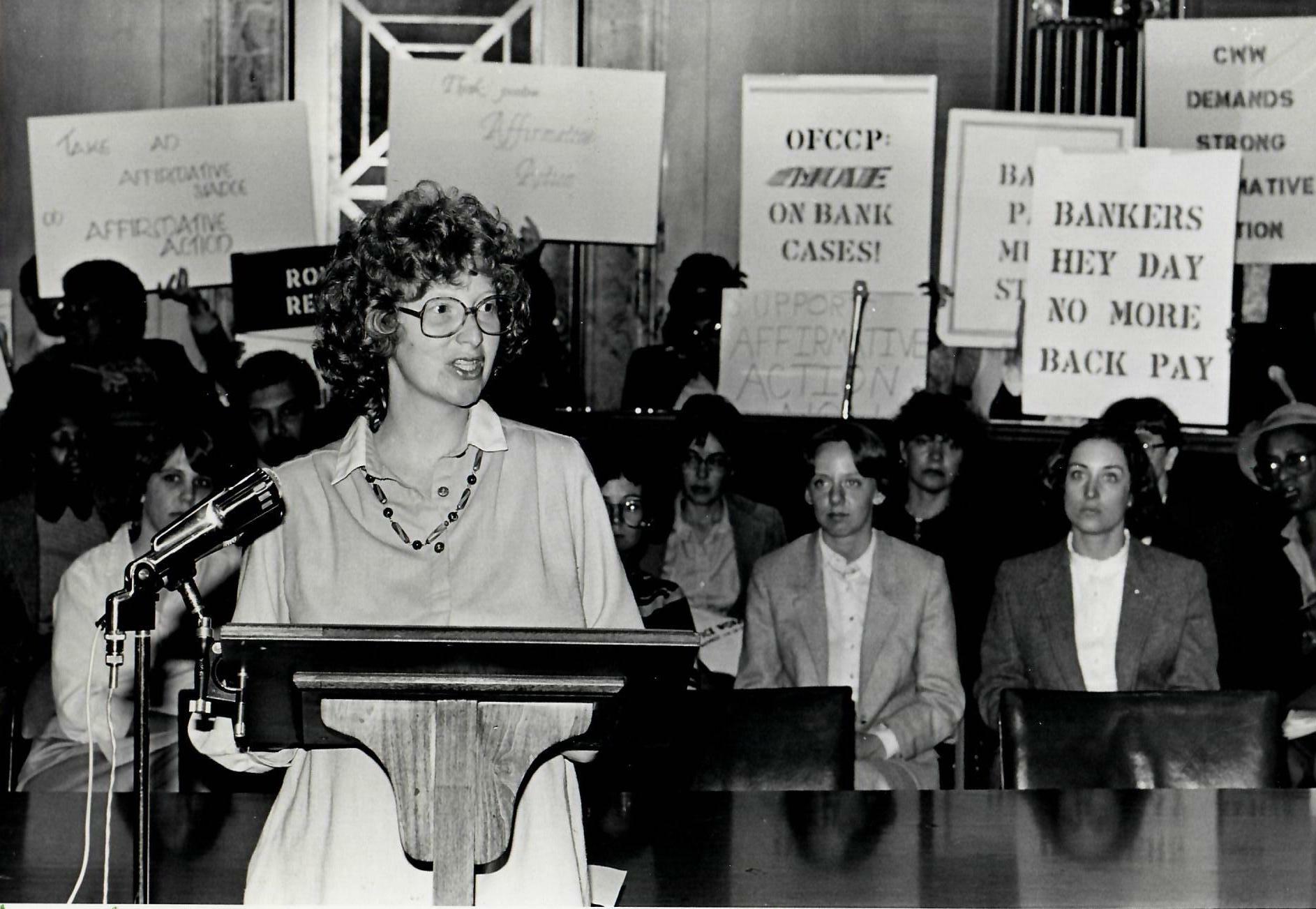 Activist Ellen Cassedy speaking at an event. In 1973, Cassedy and her friend Karen Nussbaum established the 9 to 5 National Association of Working Women. COURTESY ELLEN CASSEDY