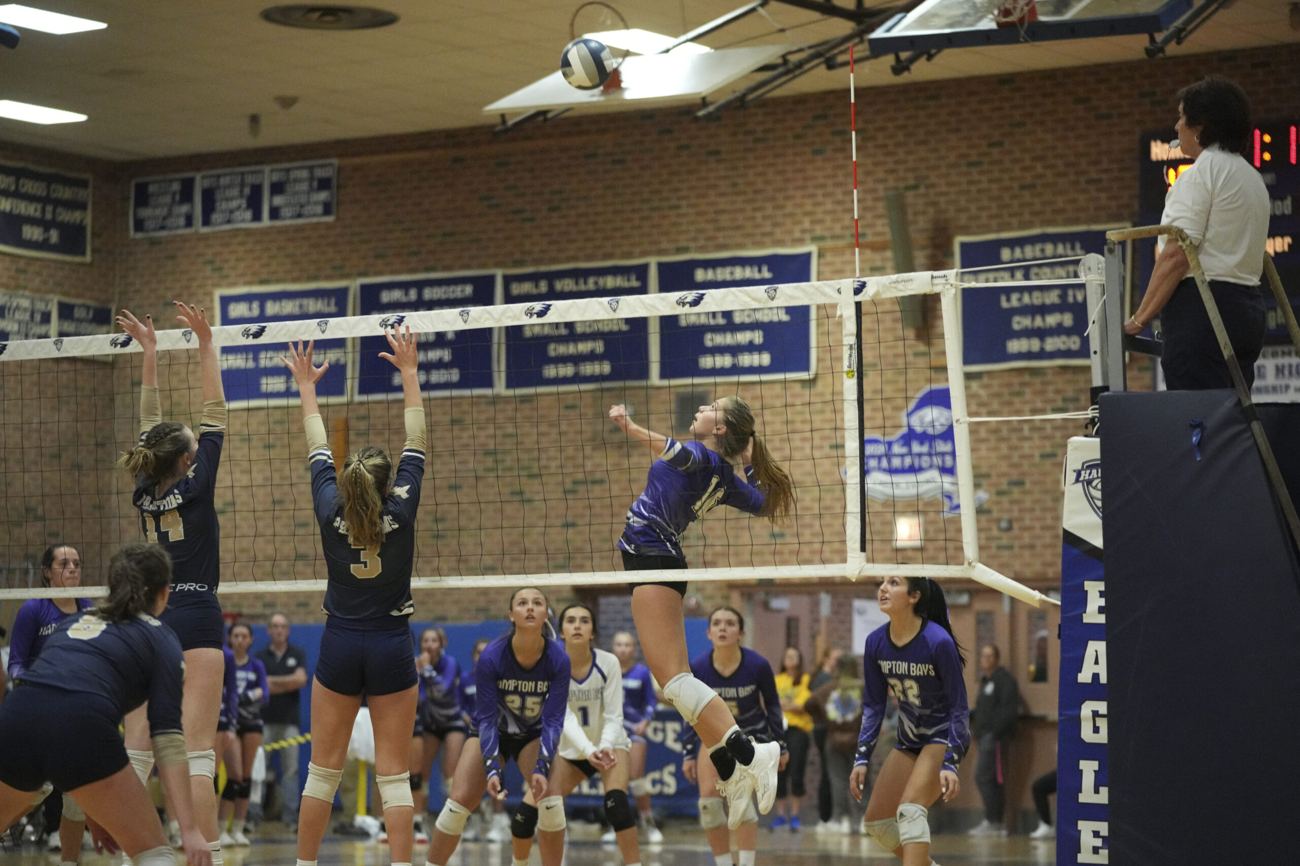 Hampton Bays senior Lily Patek keeps her eyes on the ball as she goes up for a potential kill.   RON ESPOSITO