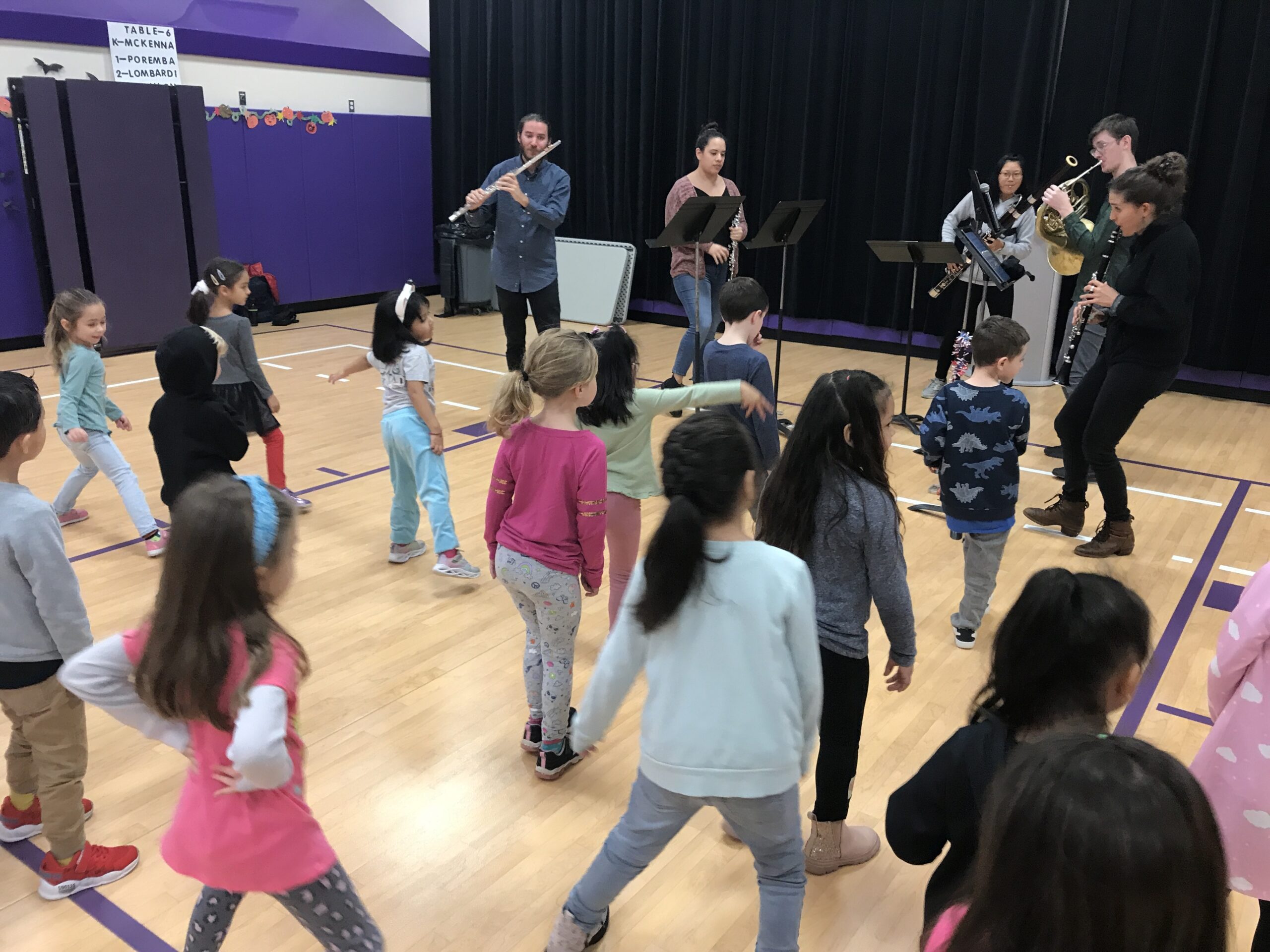 Hampton Bays Elementary School kindergartners recently received a special visit from ConnectFive, a wind quintet focused on music education. The students interacted with the music to hear and move with different tempos and meters. The program was organized by Quogue Chamber Music and  funded by grants. COURTESY HAMPTON BAYS SCHOOL DISTRICT