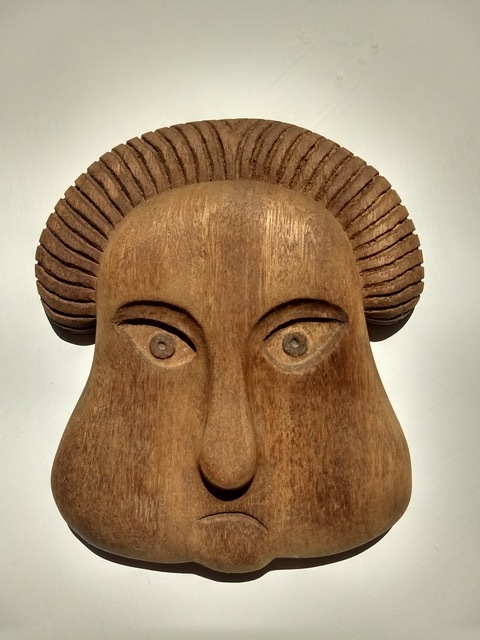 A carving in wood by David Cosgrove, based on a carving from an 18th-century colonial cemetery gravestone.