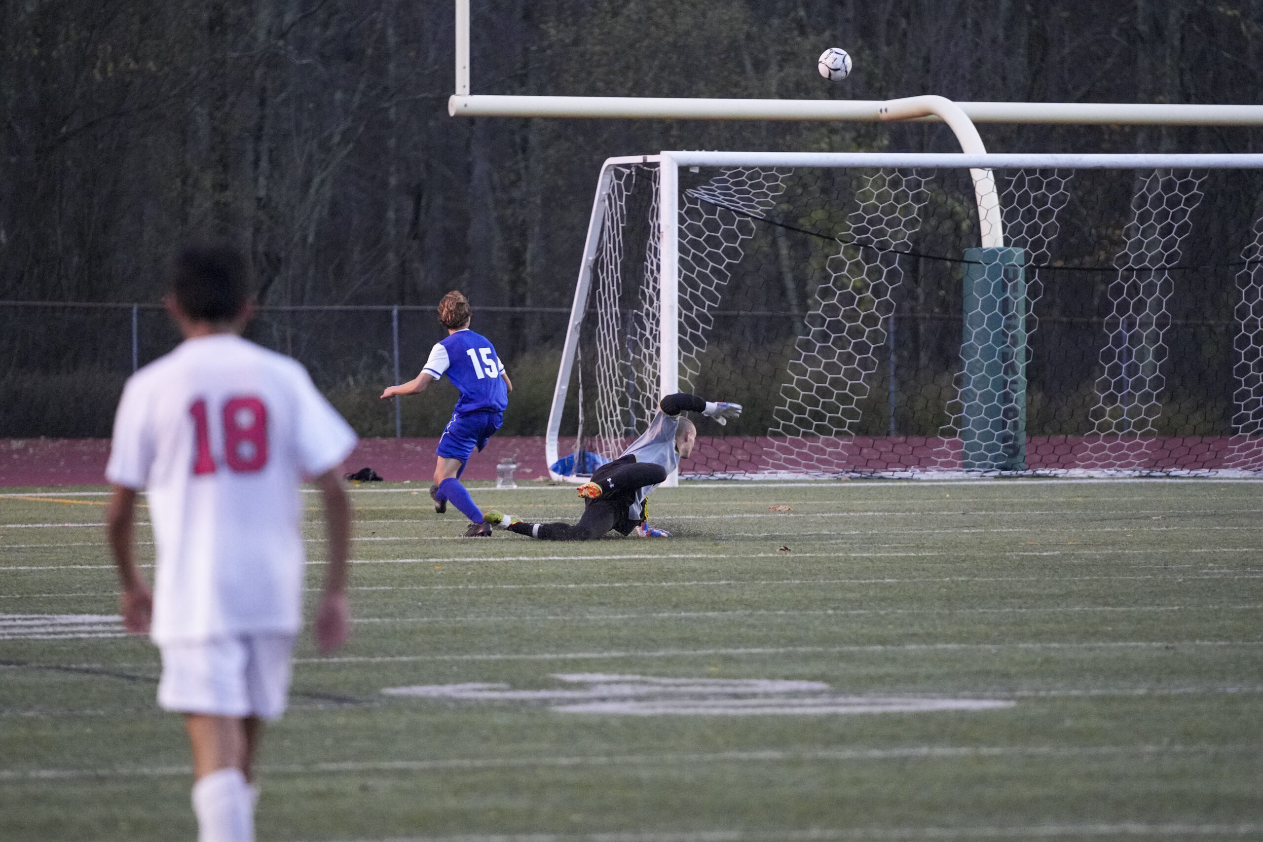 Haldane junior Max Westphal gets the ball over Pierson senior goalie Gavin Gilbride for the first goal of the game in the second half.    RON ESPOSITO