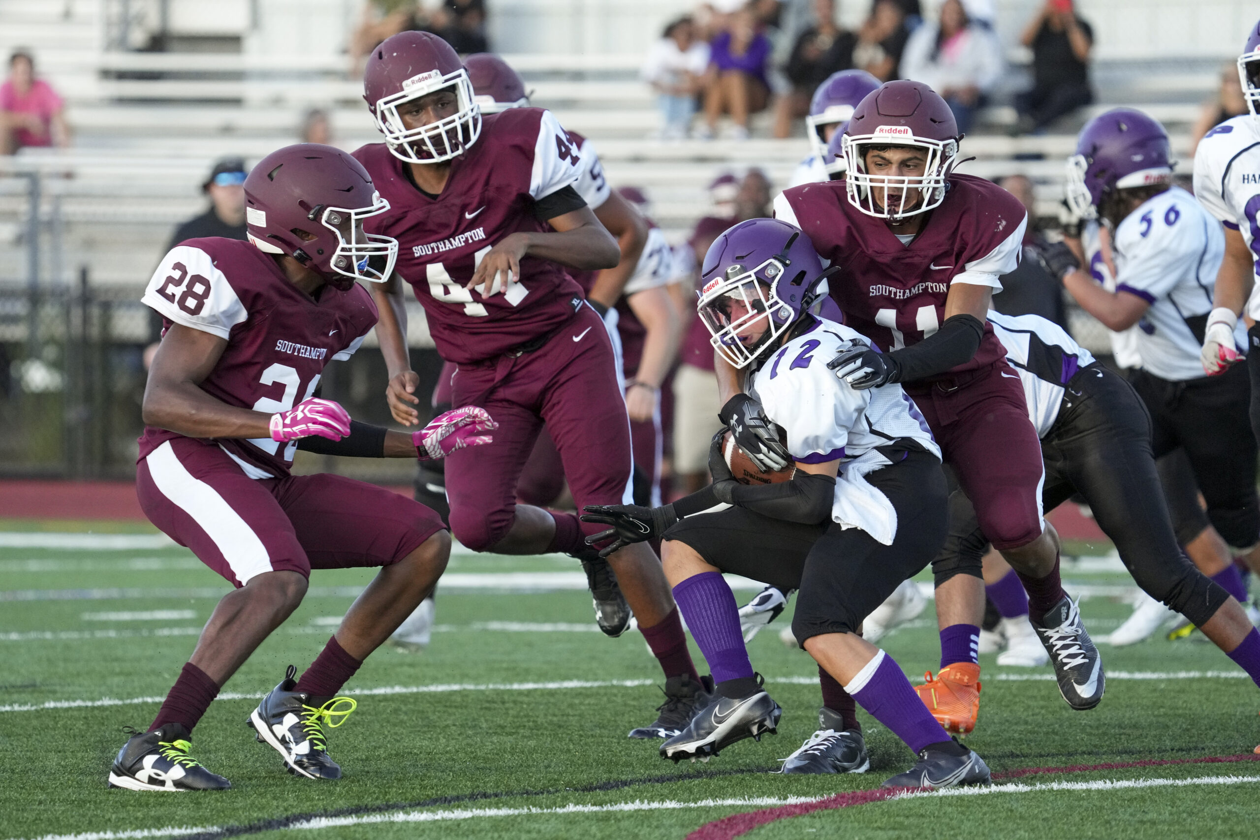 Alex Franklin (11) and Naevon Jenkins team up for a stop.  RON ESPOSITO